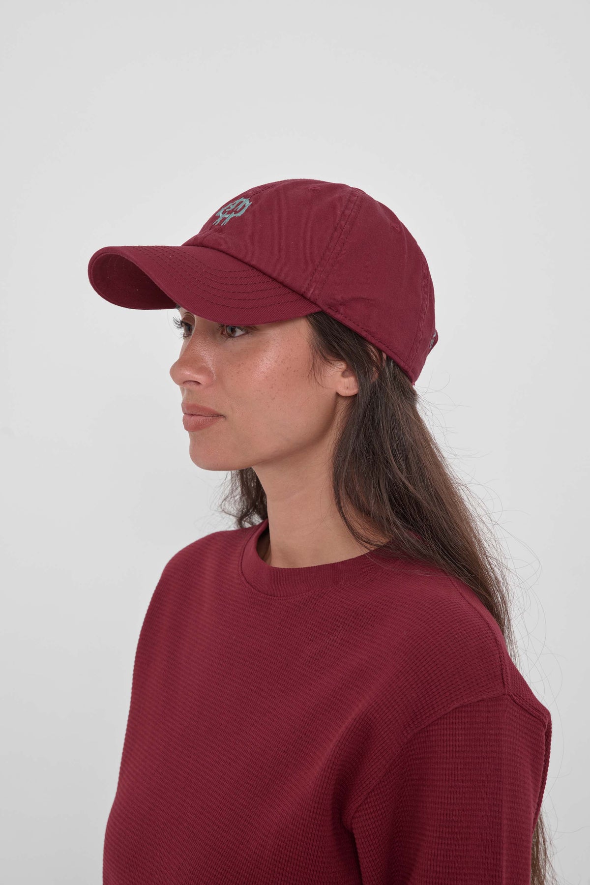 Bucky Logo Cap in Garnet - side view of model