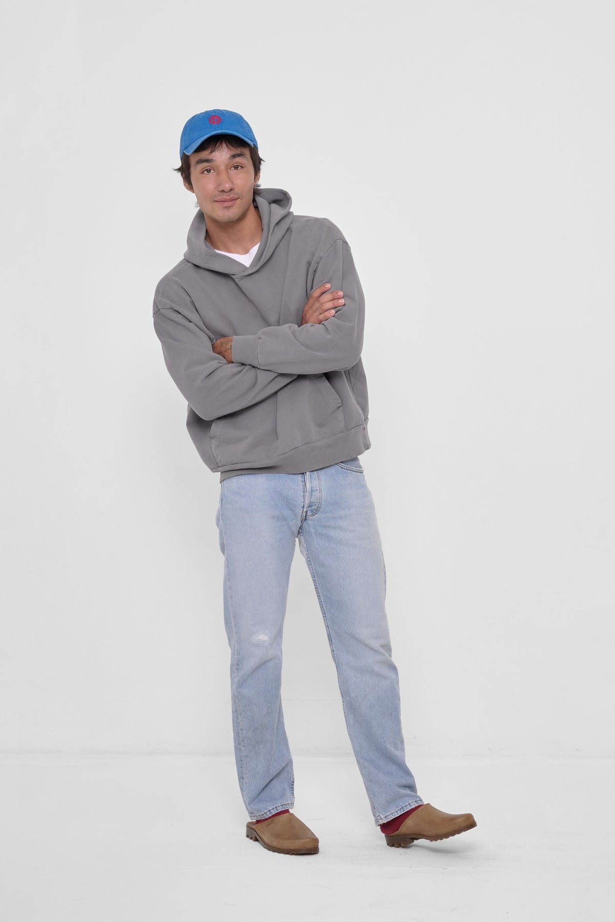 Bucky Logo Cap in Malibu - full front body view of model, styled with Stone Trash Hoodie, jeans, and Plasticana Mules