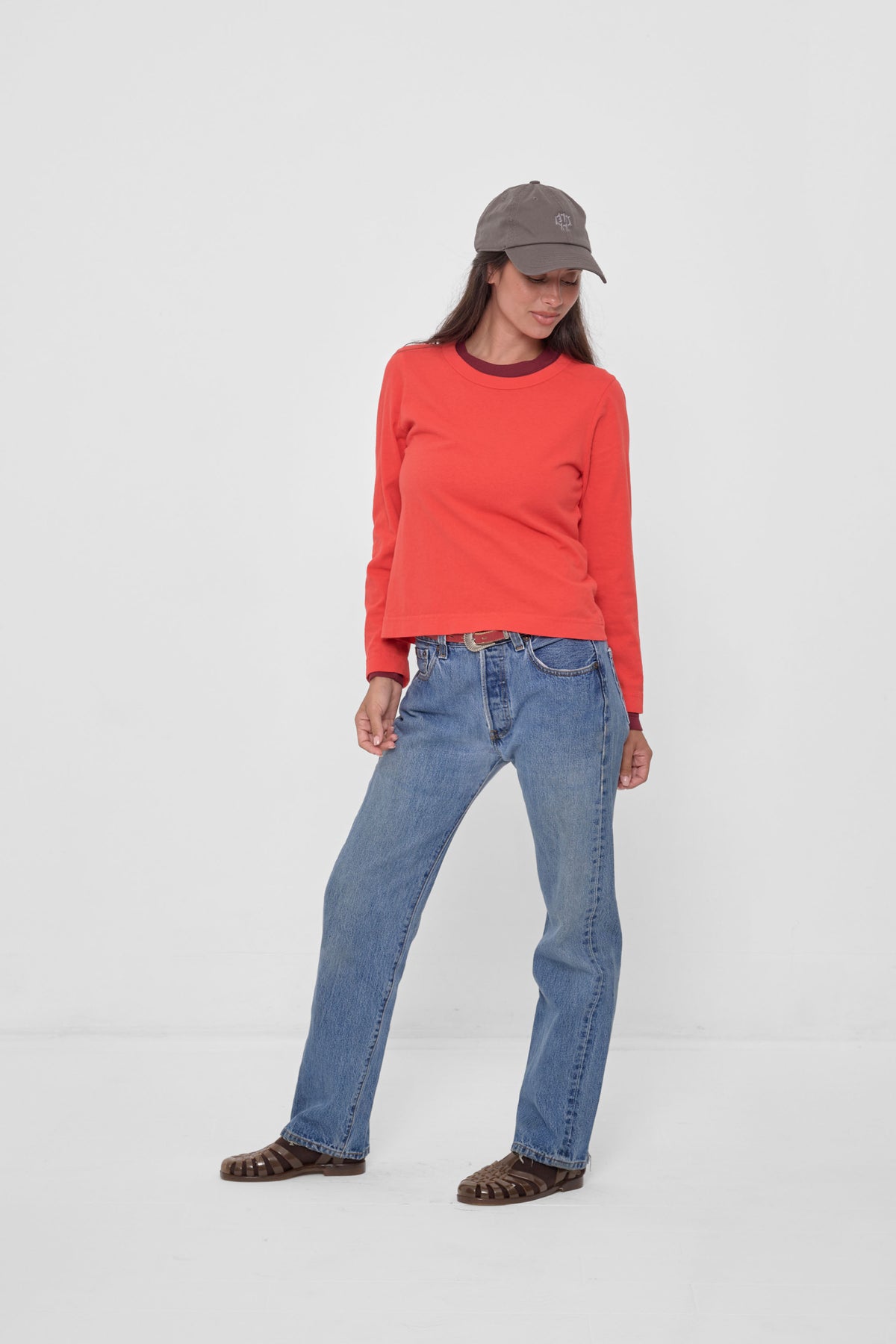 Bucky Logo Cap in Stone - full body front view of model, styled with Lava Straight Sleeve Tailored Trash Tee, jeans, and Plasticana Jelly Sandals