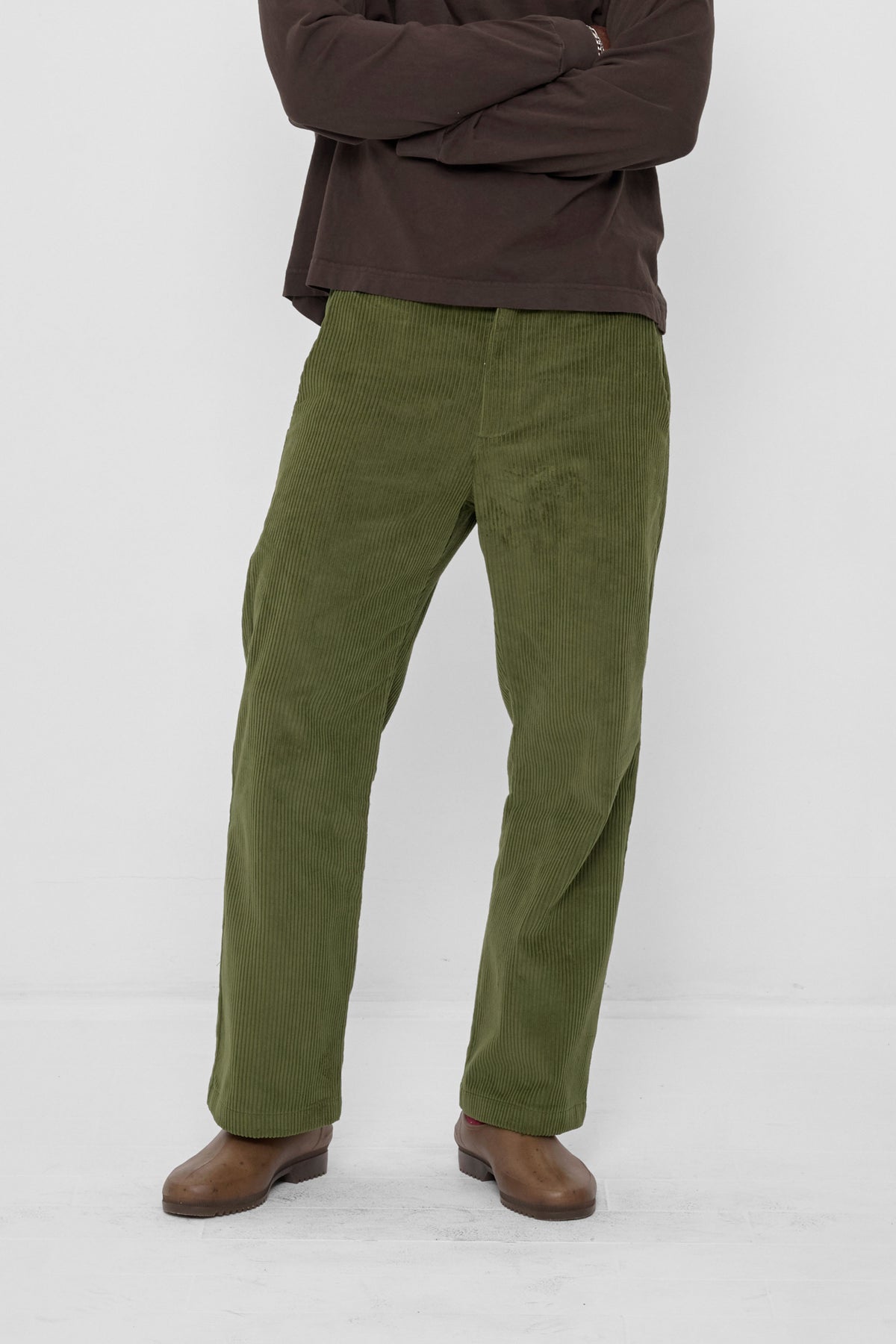 Cord Pants in Olive – front view on model
