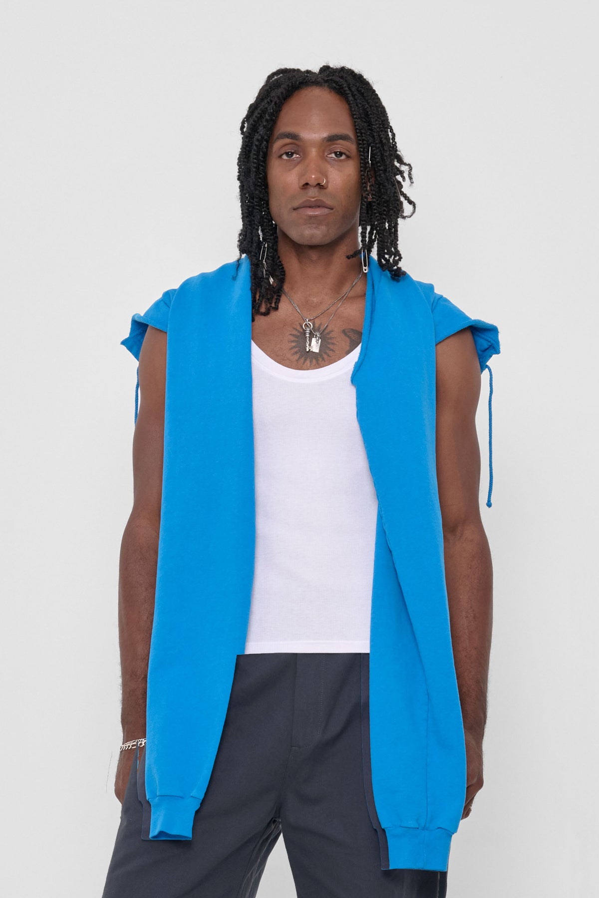 Clyde x Everybody.World Hoodie Scarf in Malibu – front view on model, worn untied and with hood down