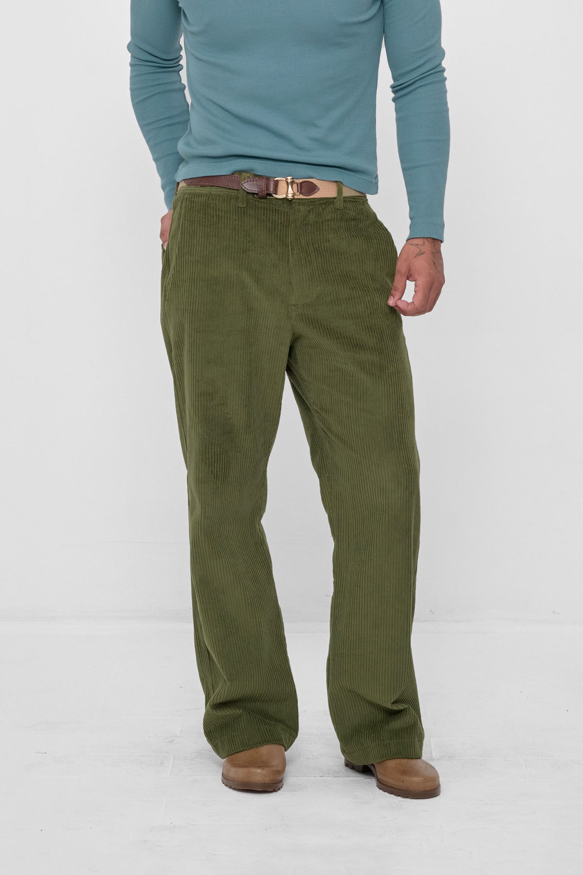 Cord Pants in Olive – front view on model