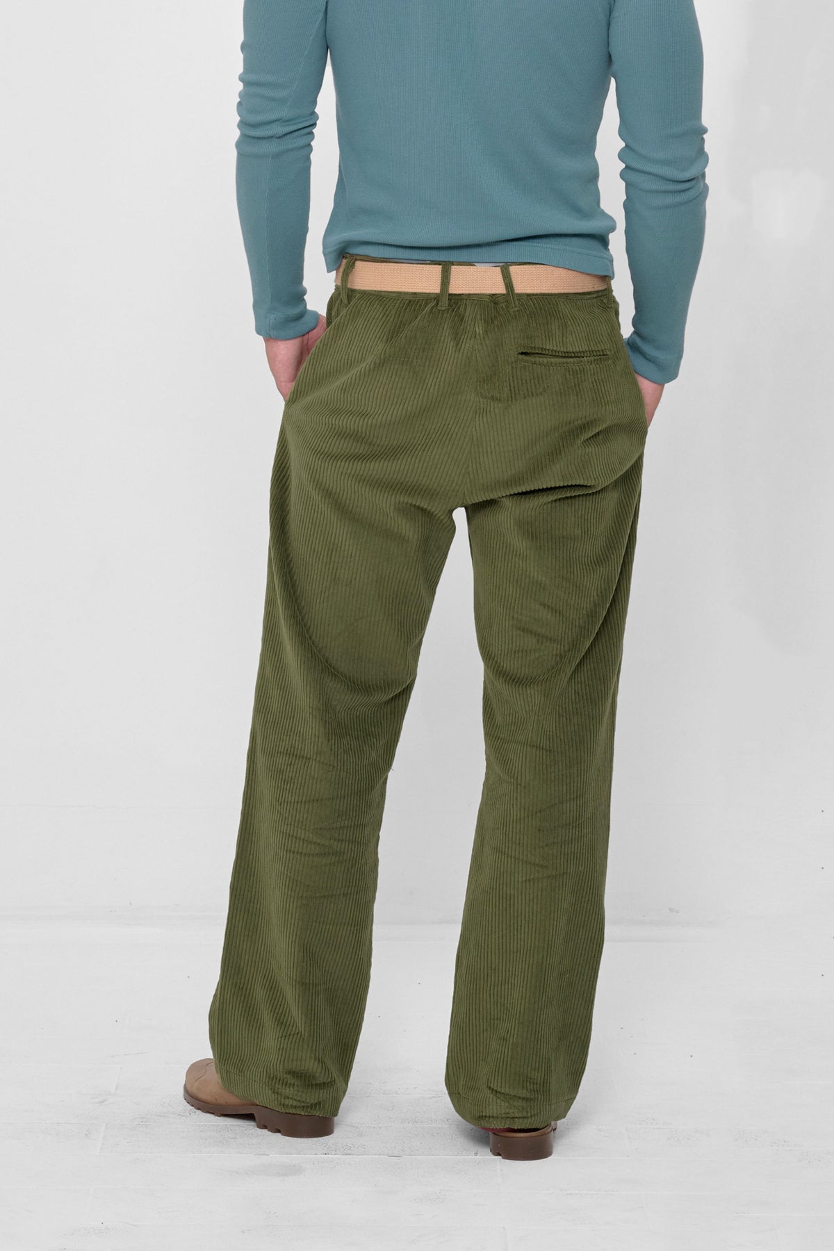 Cord Pants in Olive – back view on model