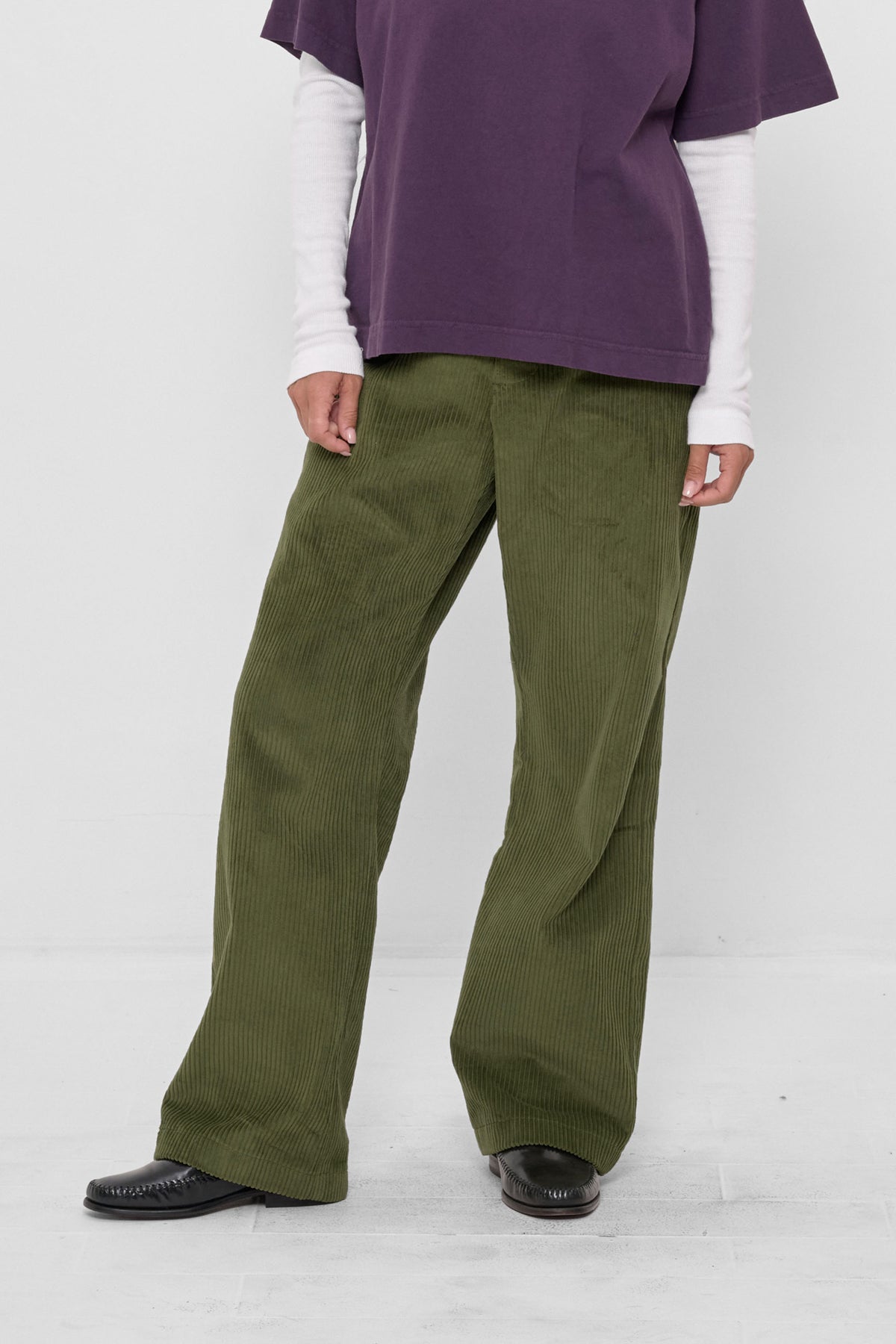 Cord Pants in Olive – front view on model