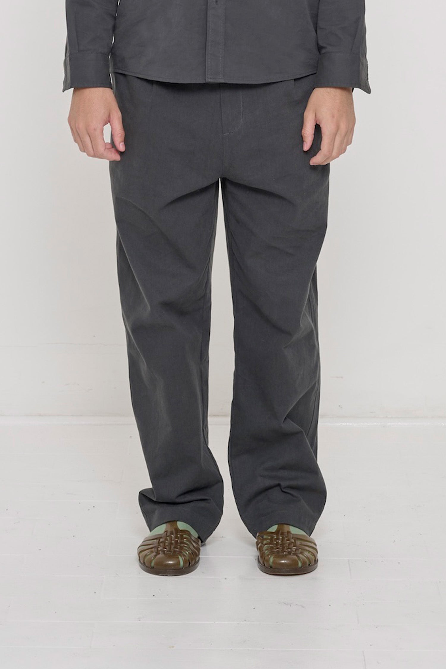 Bottom half of a person in Slate Cotton Twill Life Uniform Pants. Shows relaxed slim silhouette.