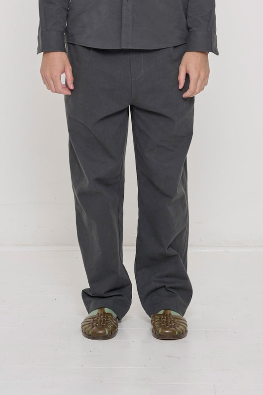 Bottom half of a person in Slate Cotton Twill Life Uniform Pants. Shows relaxed slim silhouette.
