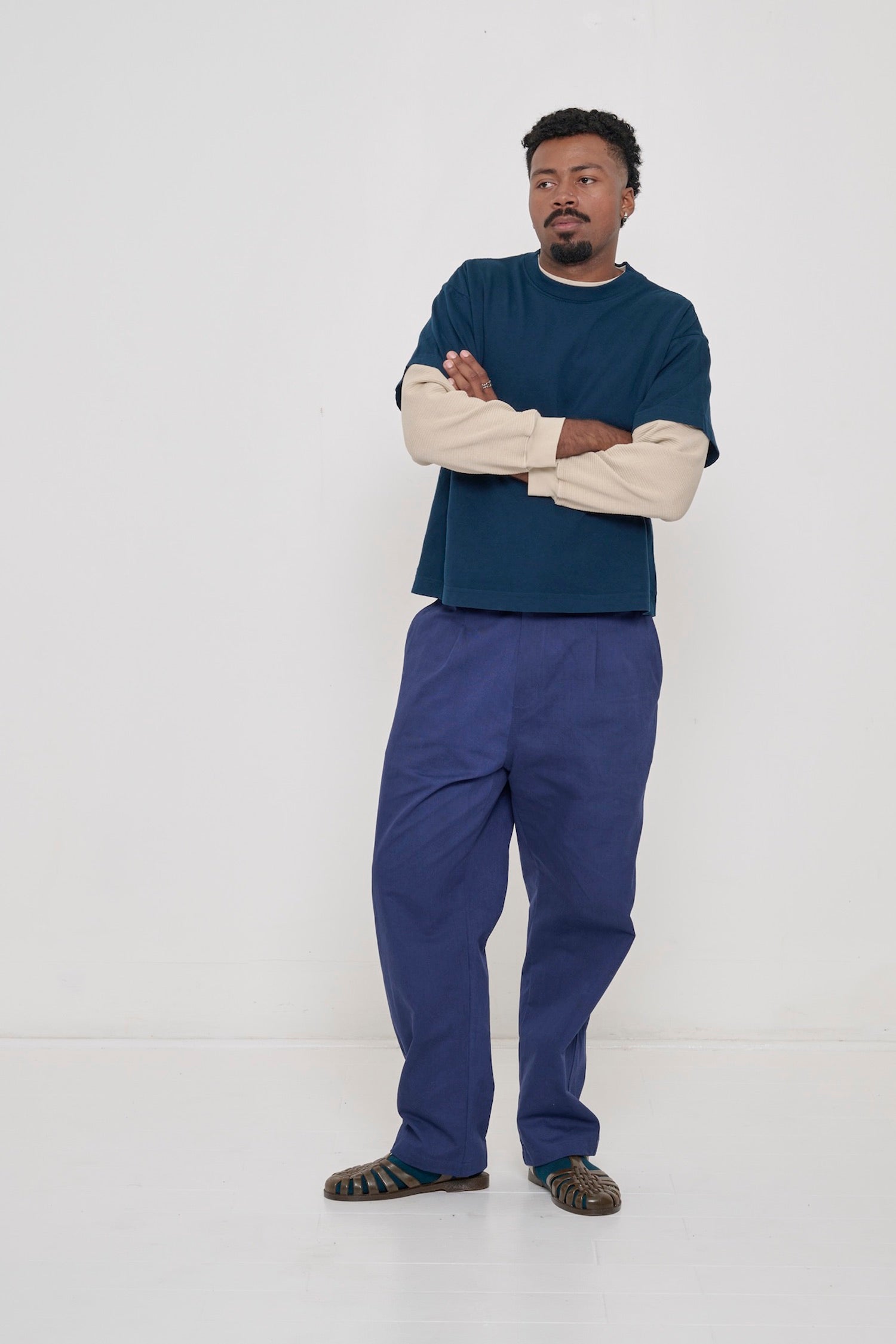 Full length view of a 6'2" tall man wearing Washed Navy Cotton Twill Life Uniform Pants, hem near the bottom of his shoes.