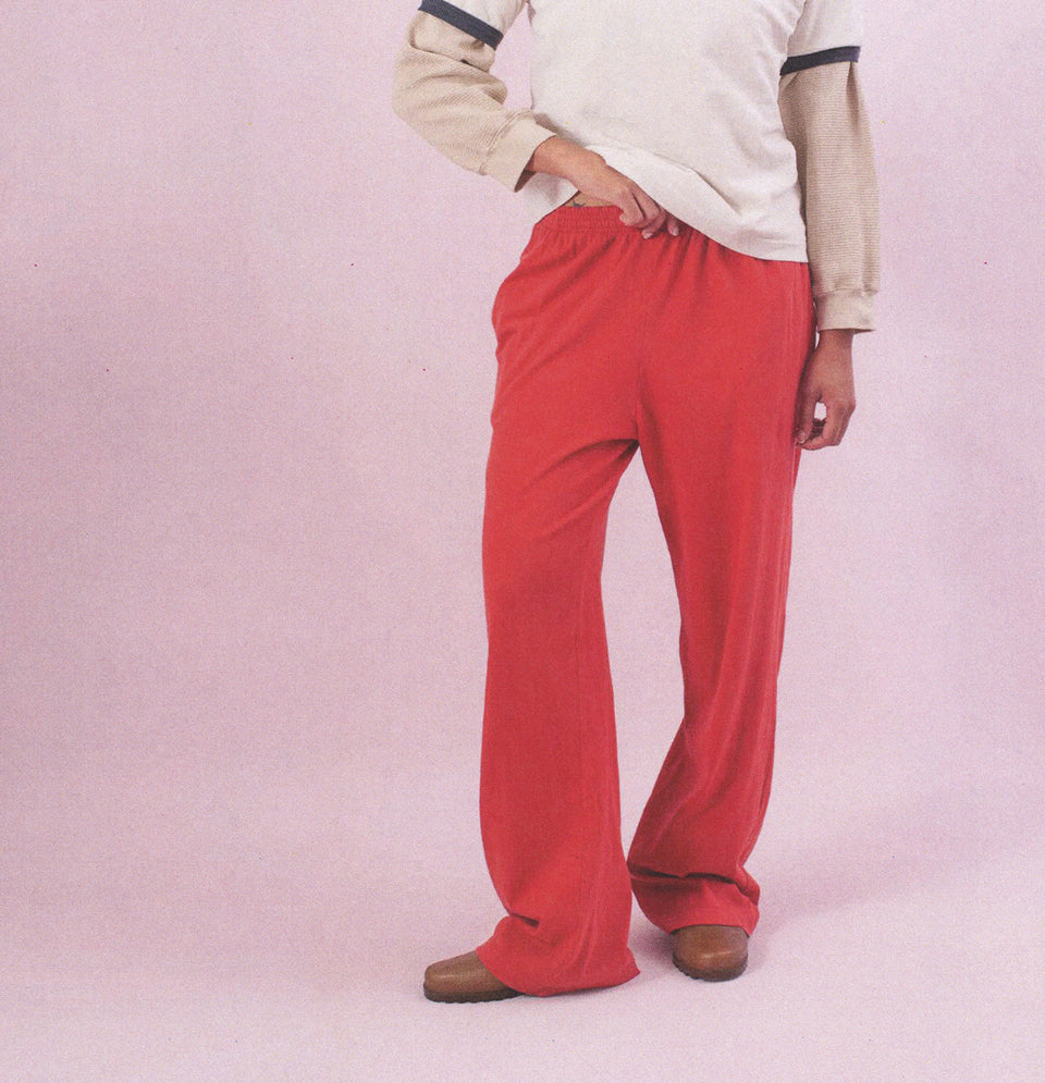 Person wearing Apartment Pants in Cedar, with a Ringer Trash Tee Layered over a Thermal Long Sleeve.