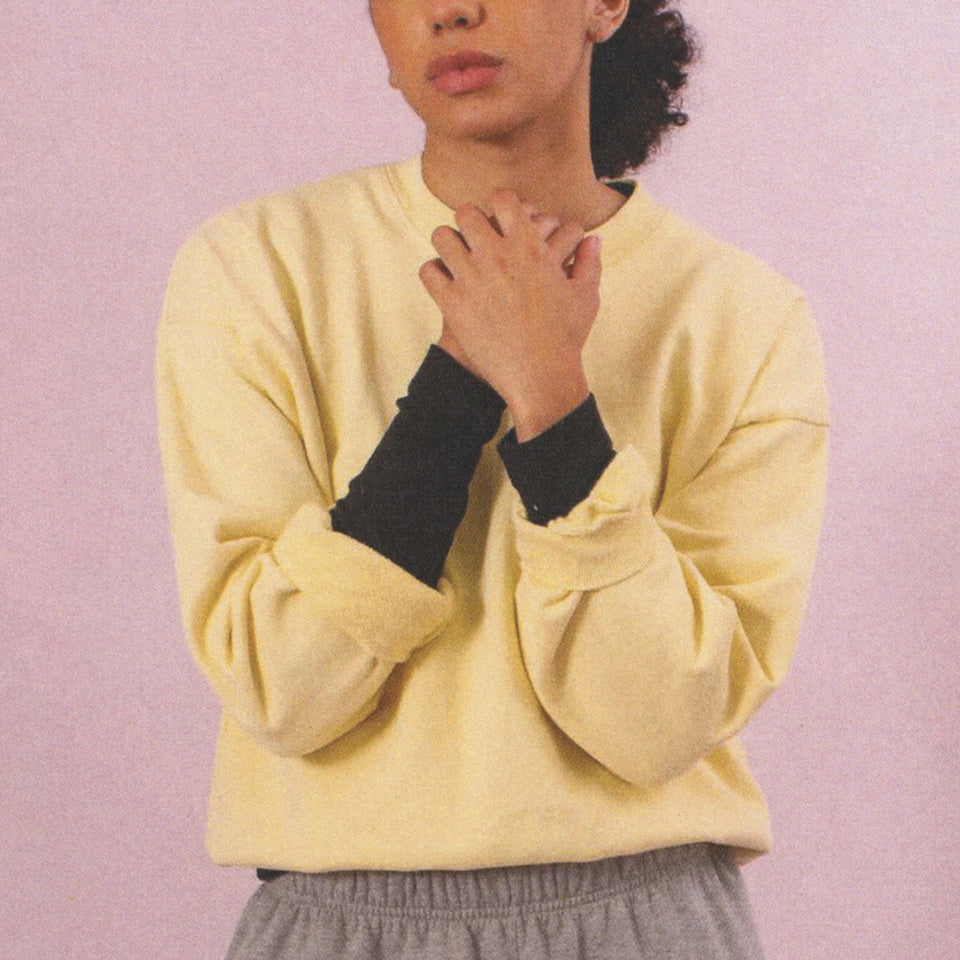 Person wearing a French Butter Trash Crewneck with Heather Sweatpants.