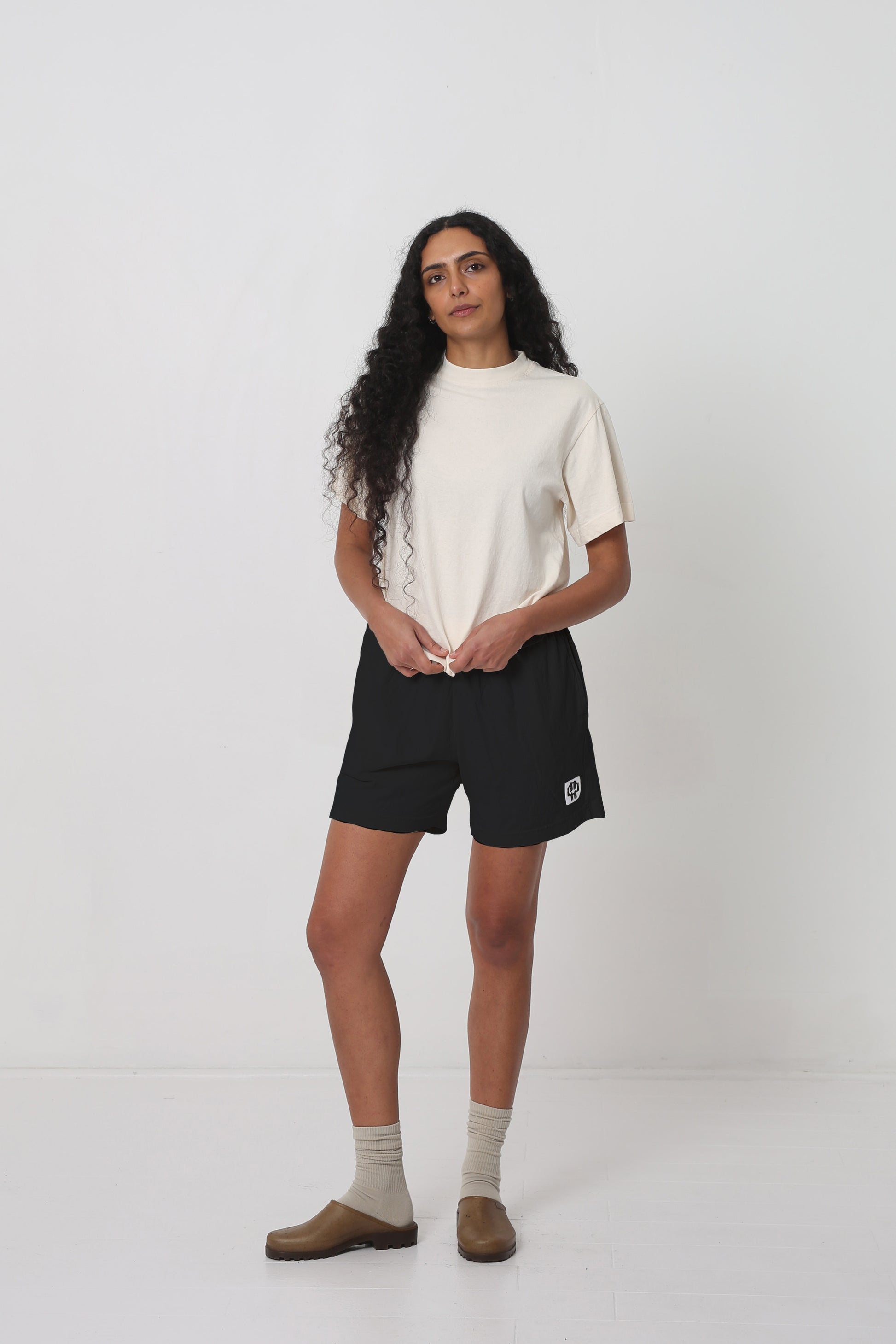 Styled with a Scour Boxier Trash Tee and Plasticana Opana Mules.