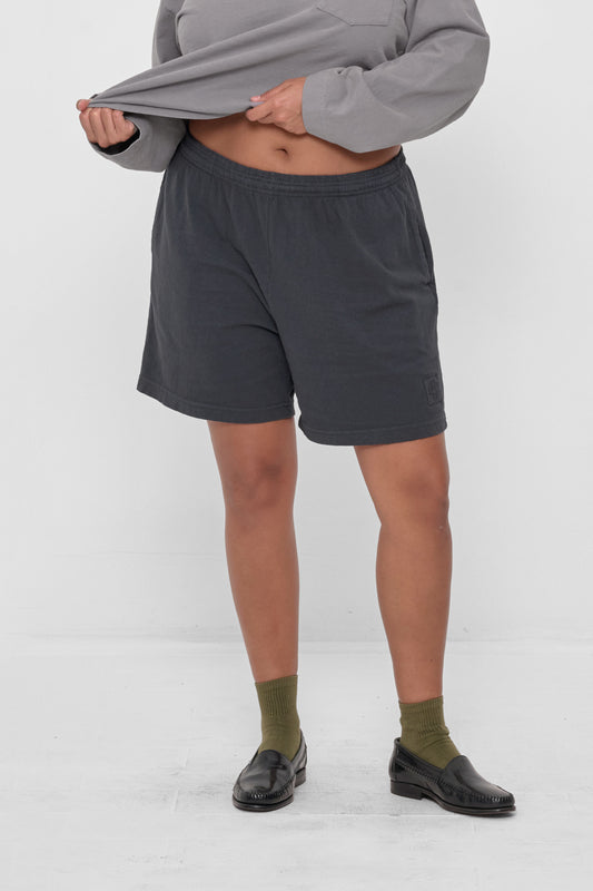 Everyday Shorts in Slate - front view, model's hands adjusting Rugby Trash Polo