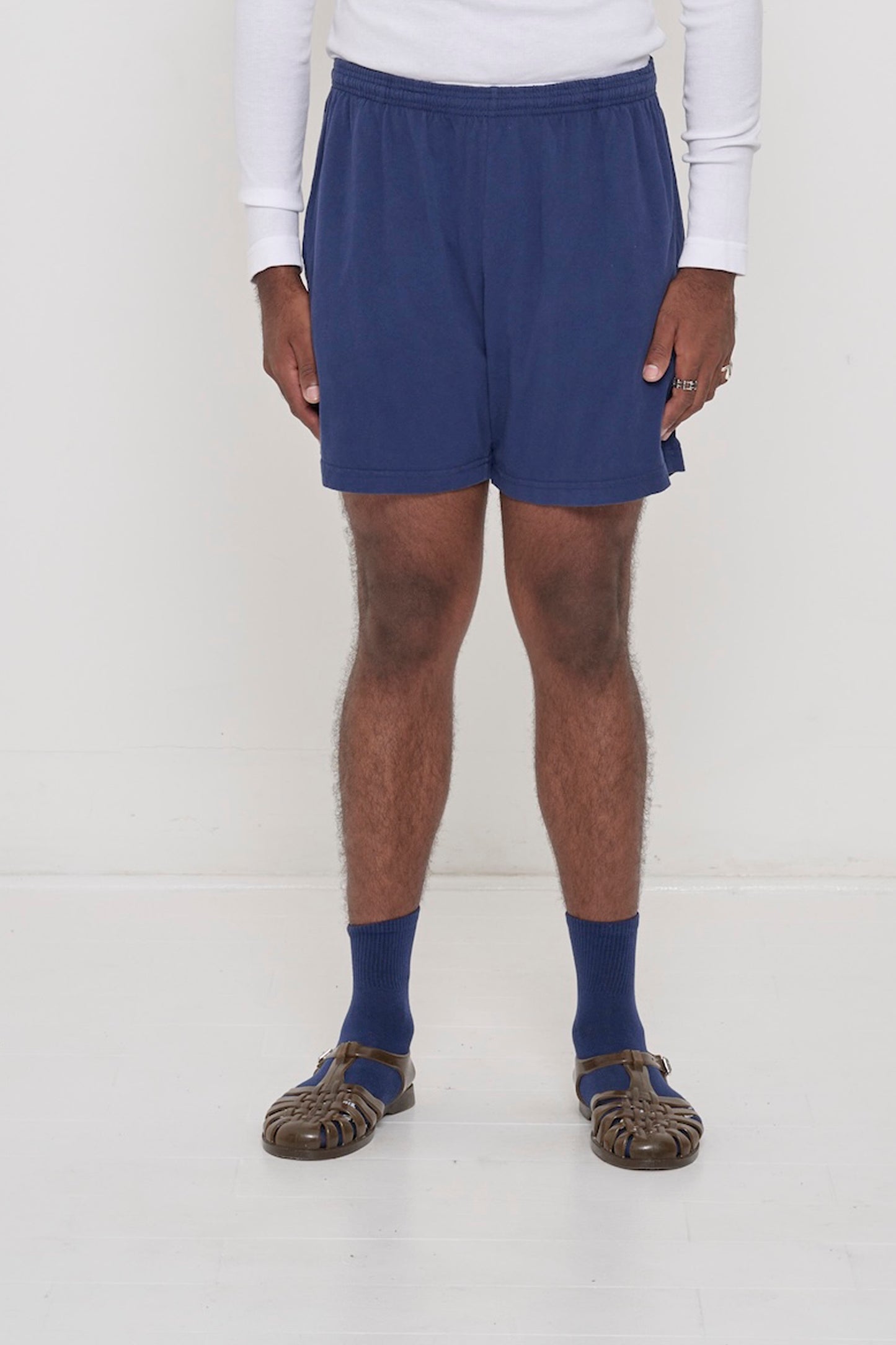 Everyday Shorts in Washed Navy on model, front. Relaxed fit, mid-thigh, elastic waist, side pockets.