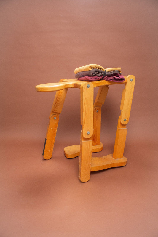 Wooden stool holding garments in Soil, Amber and Burgundy