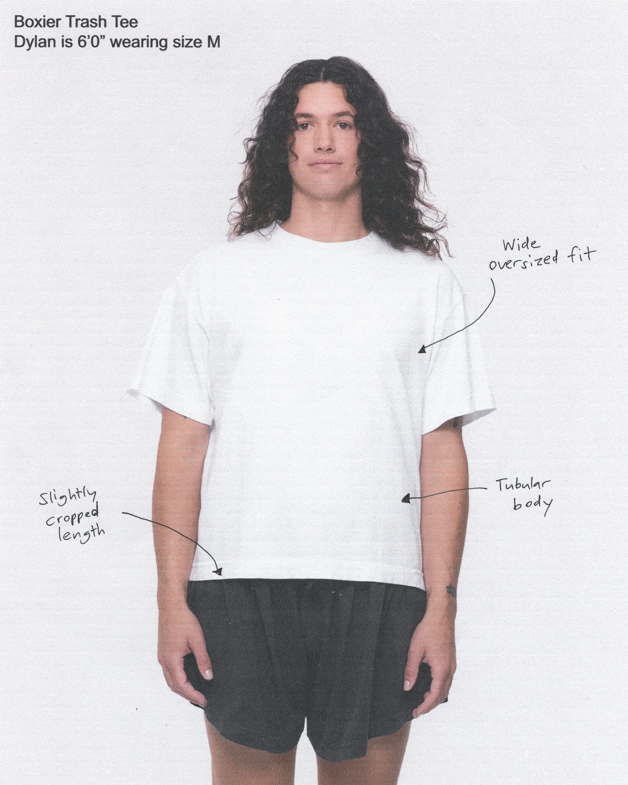 Photo of model wearing a white t-shirt, with annotated notes of clothing details.
