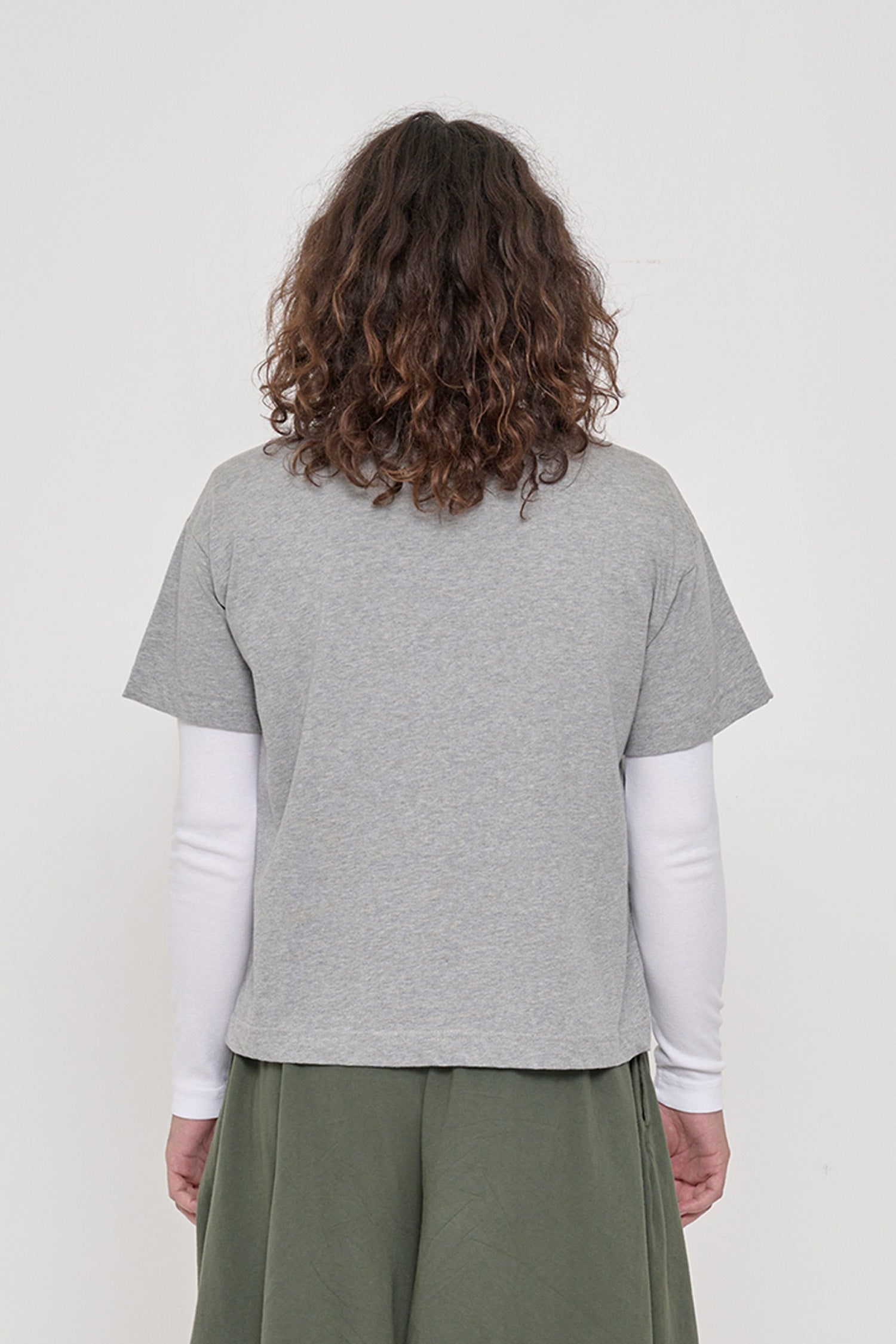 Back view of a person in a Heather Boxier Tee showing the cropped, boxy fit.