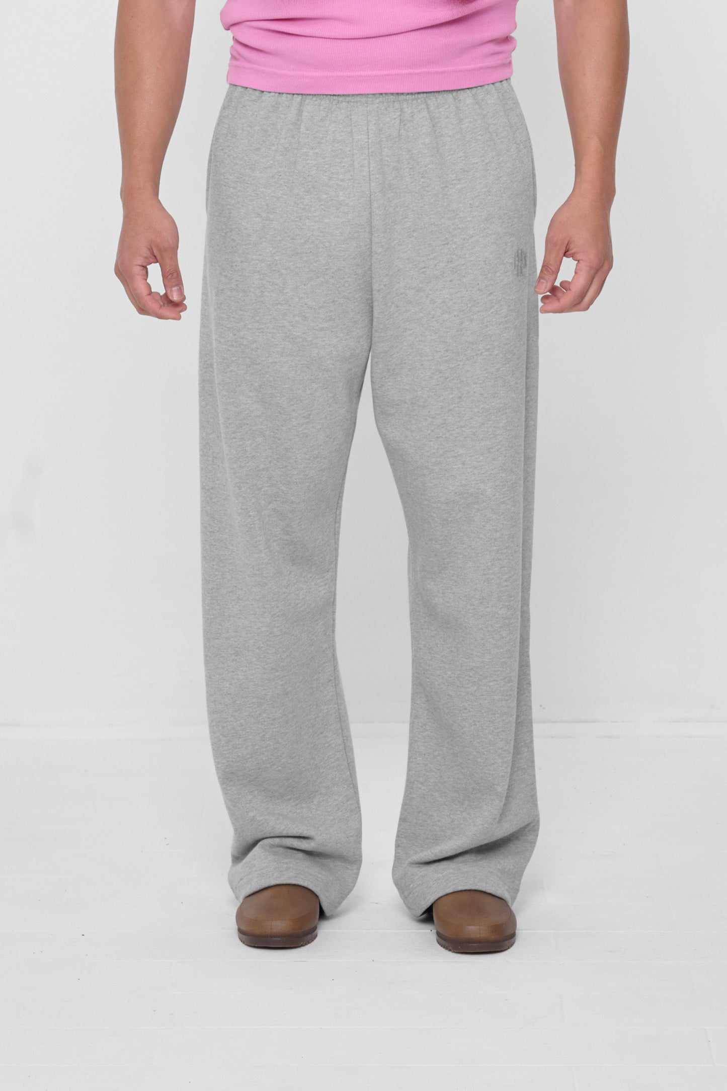 5'11" person in size L Heather Sweatpants, worn high on the hips with a relaxed fit.