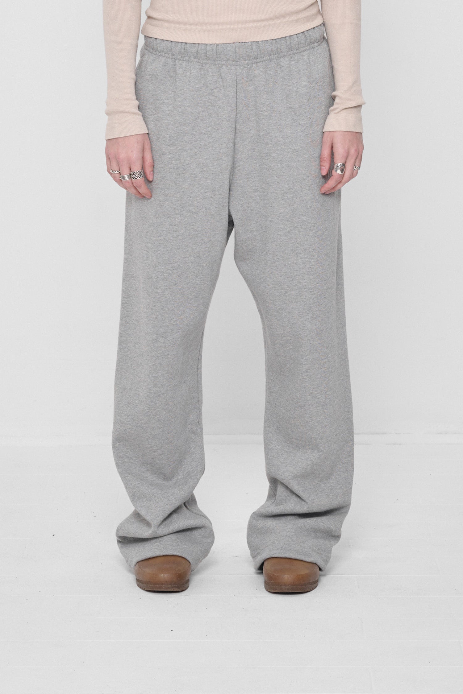 5'6" person sized up in size M Heather Sweatpants, worn high on the hips with a relaxed fit.
