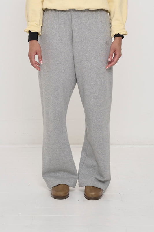 Front view: 5'8" person sized up in size L Heather Sweatpants, relaxed fit, slight bunching at the ankles.