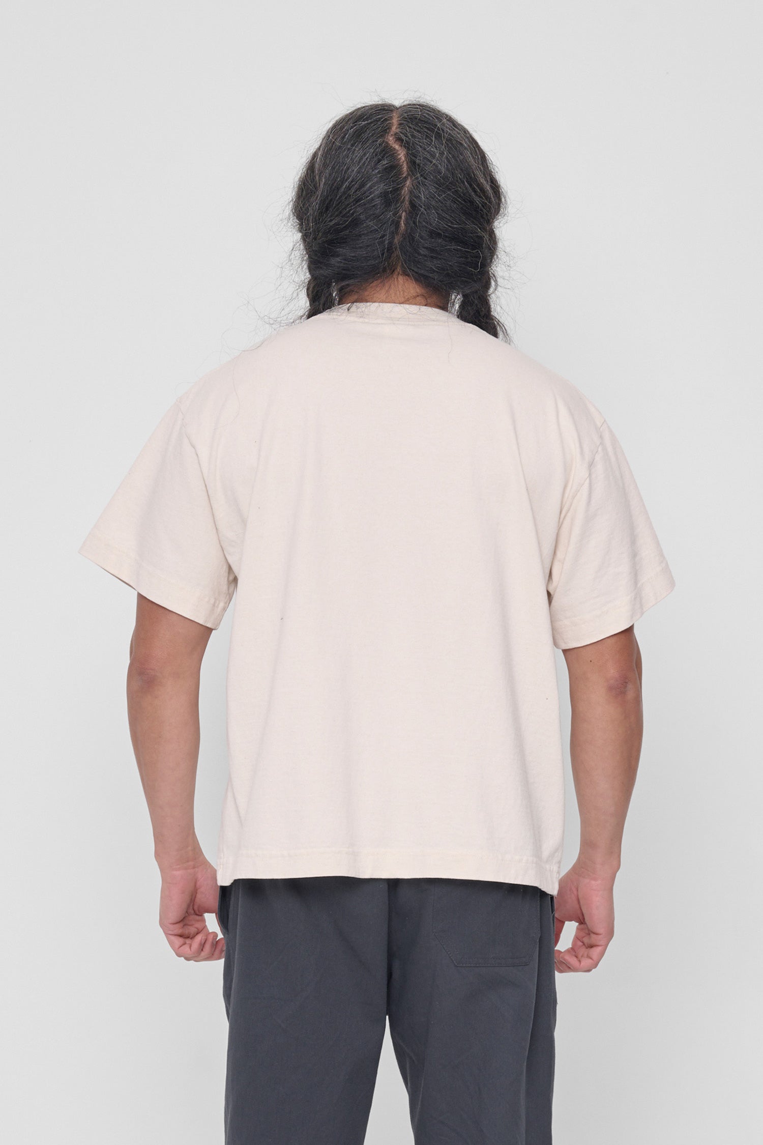 Back view shows structured sleeves and relaxed fit. 