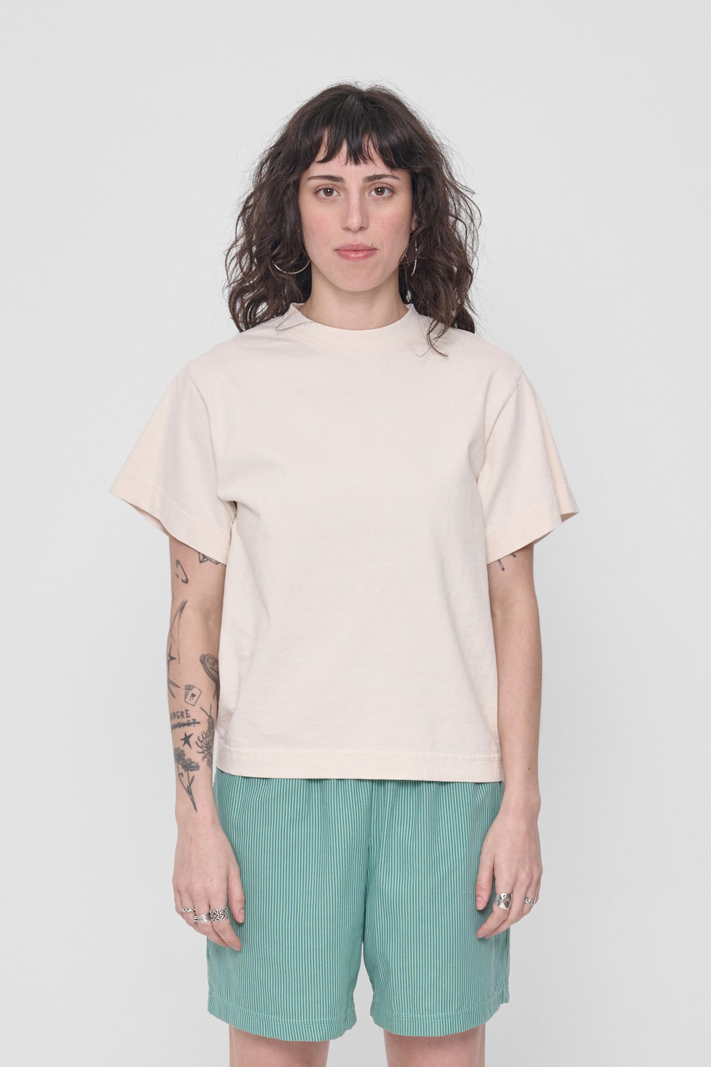 5'6" woman wearing size XS Scour Heavyweight Boxier Trash Tee. Hem is at her middle hip.
