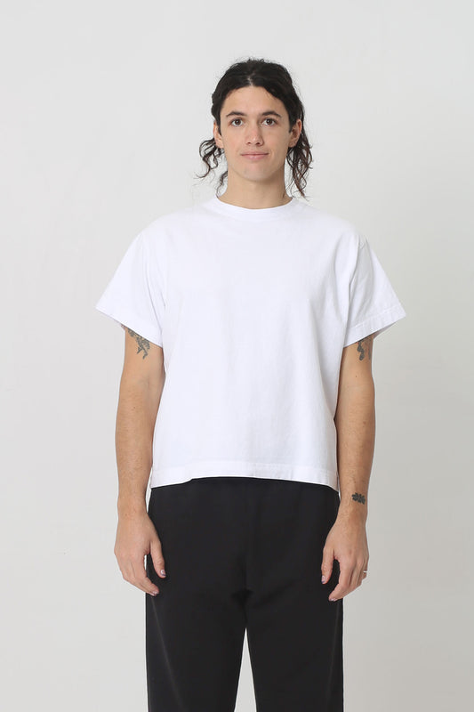 6' person in a White Heavyweight Boxier Trash Tee, size M. Hem ends at their middle hip.