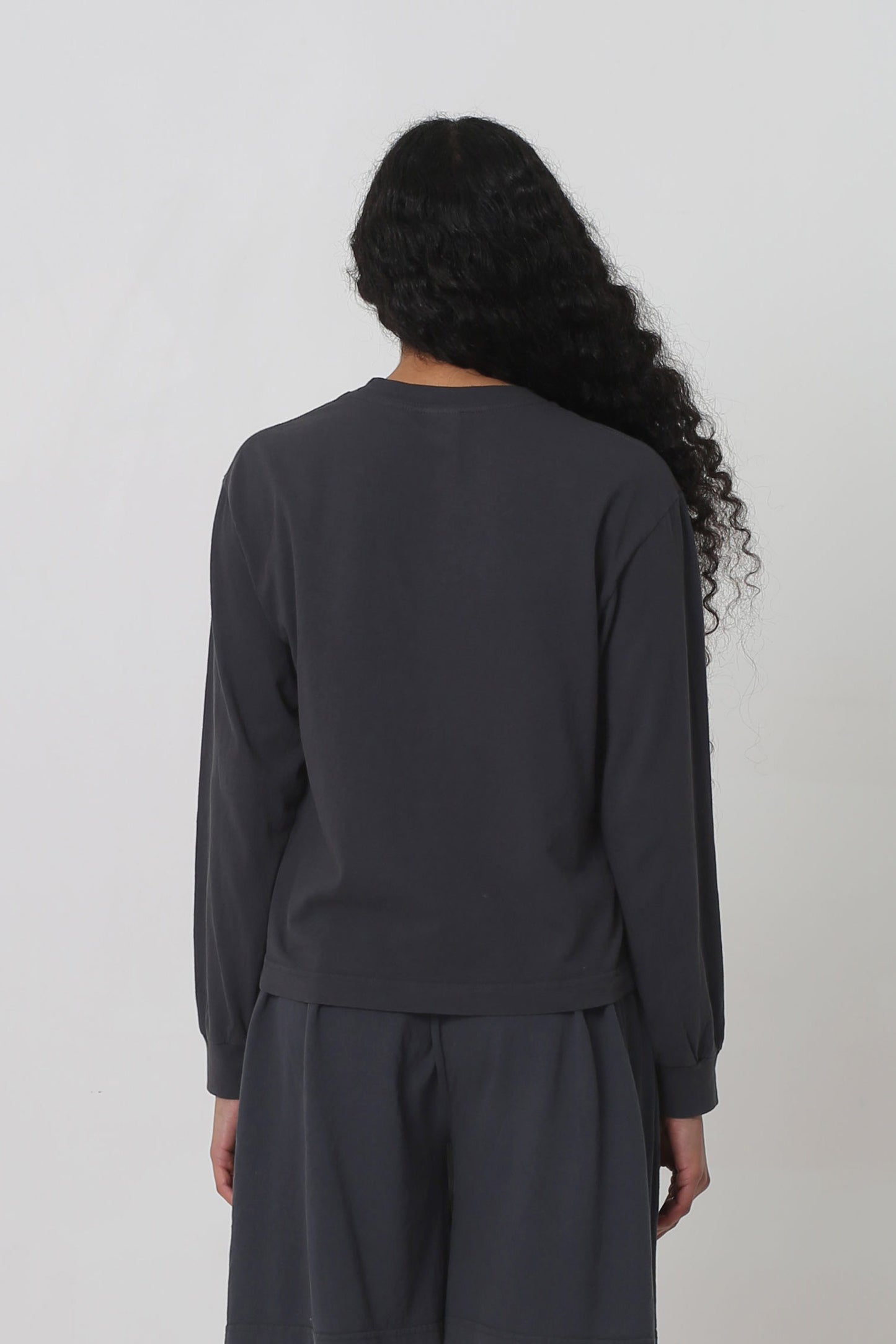 Back: shirt fabric is relaxed and hangs with a medium amount of ease. 