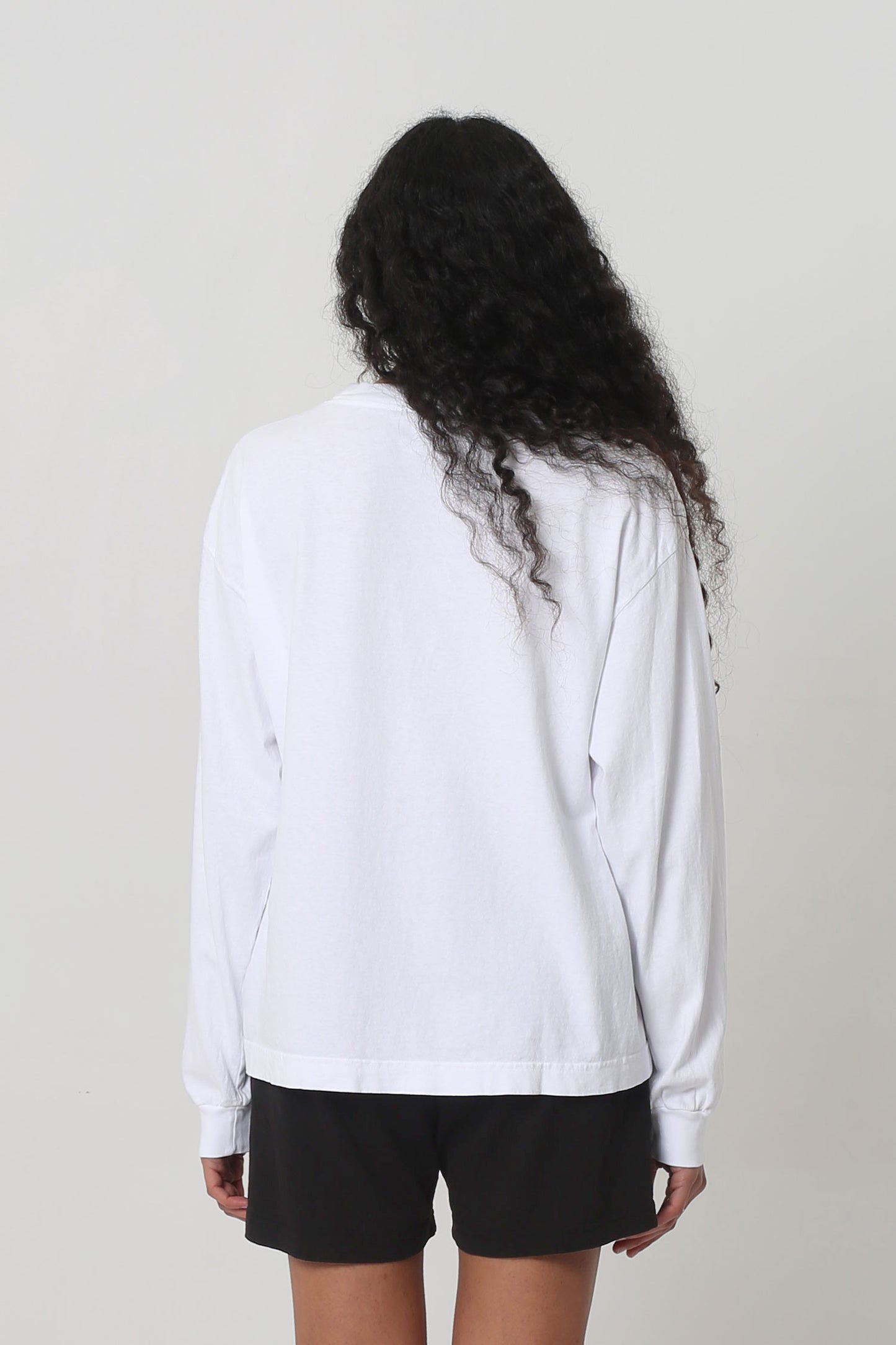Back: shirt fabric is relaxed and hangs with a medium amount of ease. 