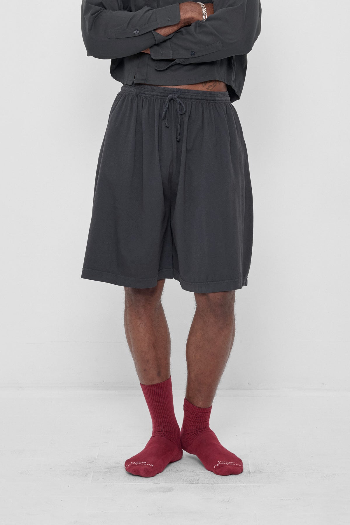 Long Tubular Shorts in Slate – front view on model