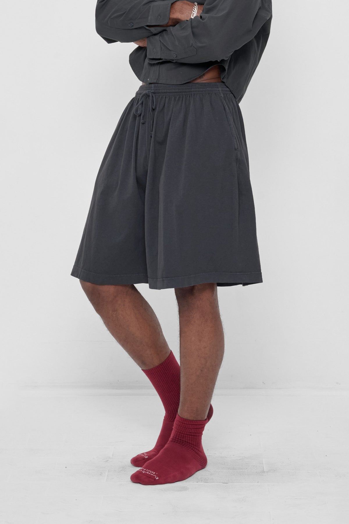 Long Tubular Shorts in Slate – 3/4 front view on model
