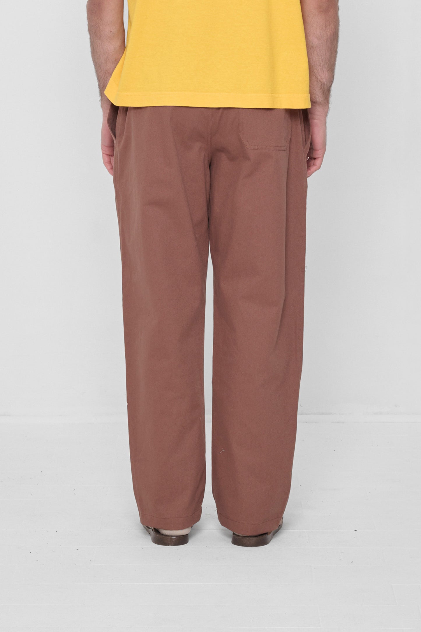 Back view showing the relaxed fit, fabric drape and back pocket. 