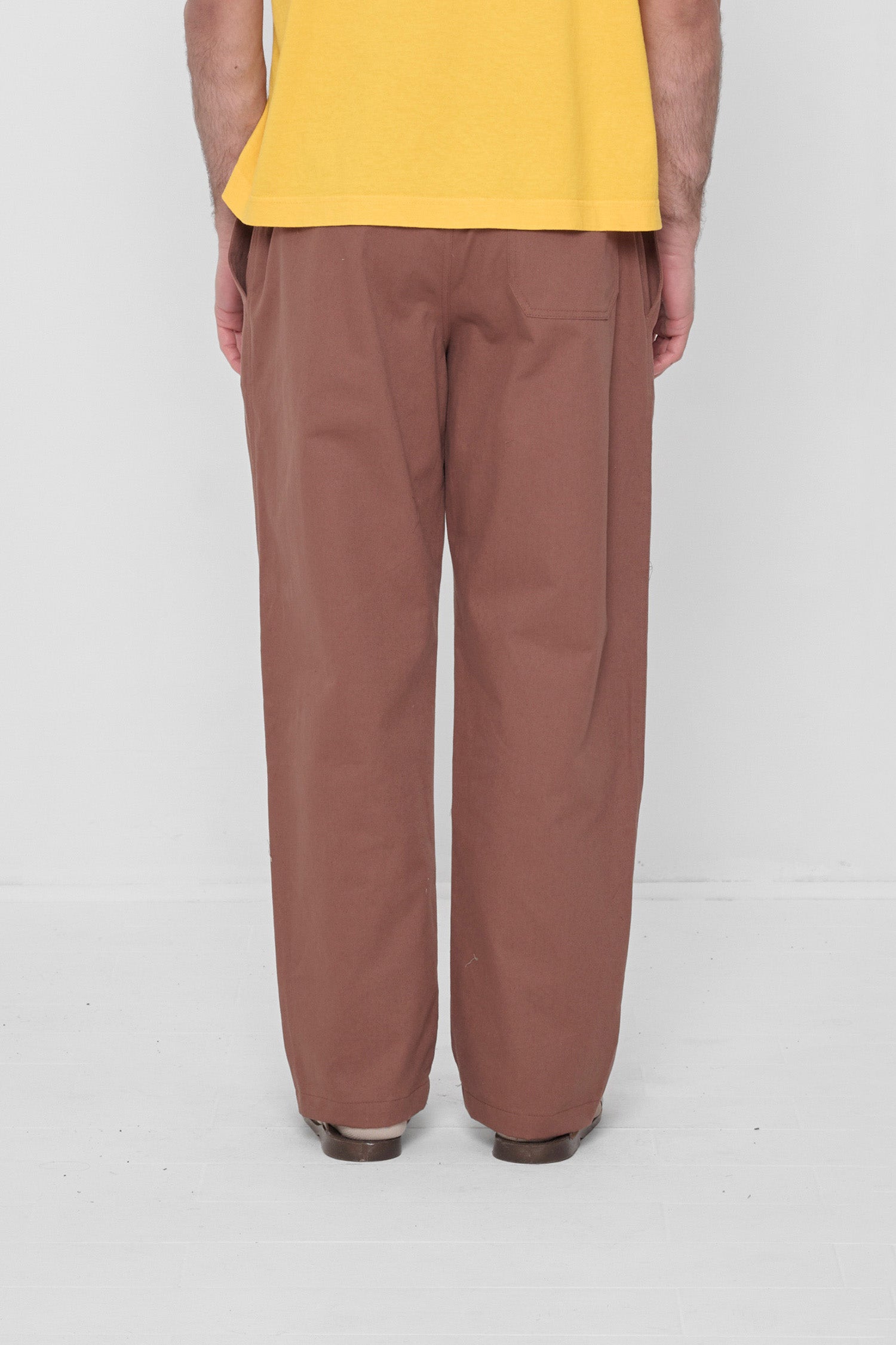 Back view showing the relaxed fit, fabric drape and back pocket. 