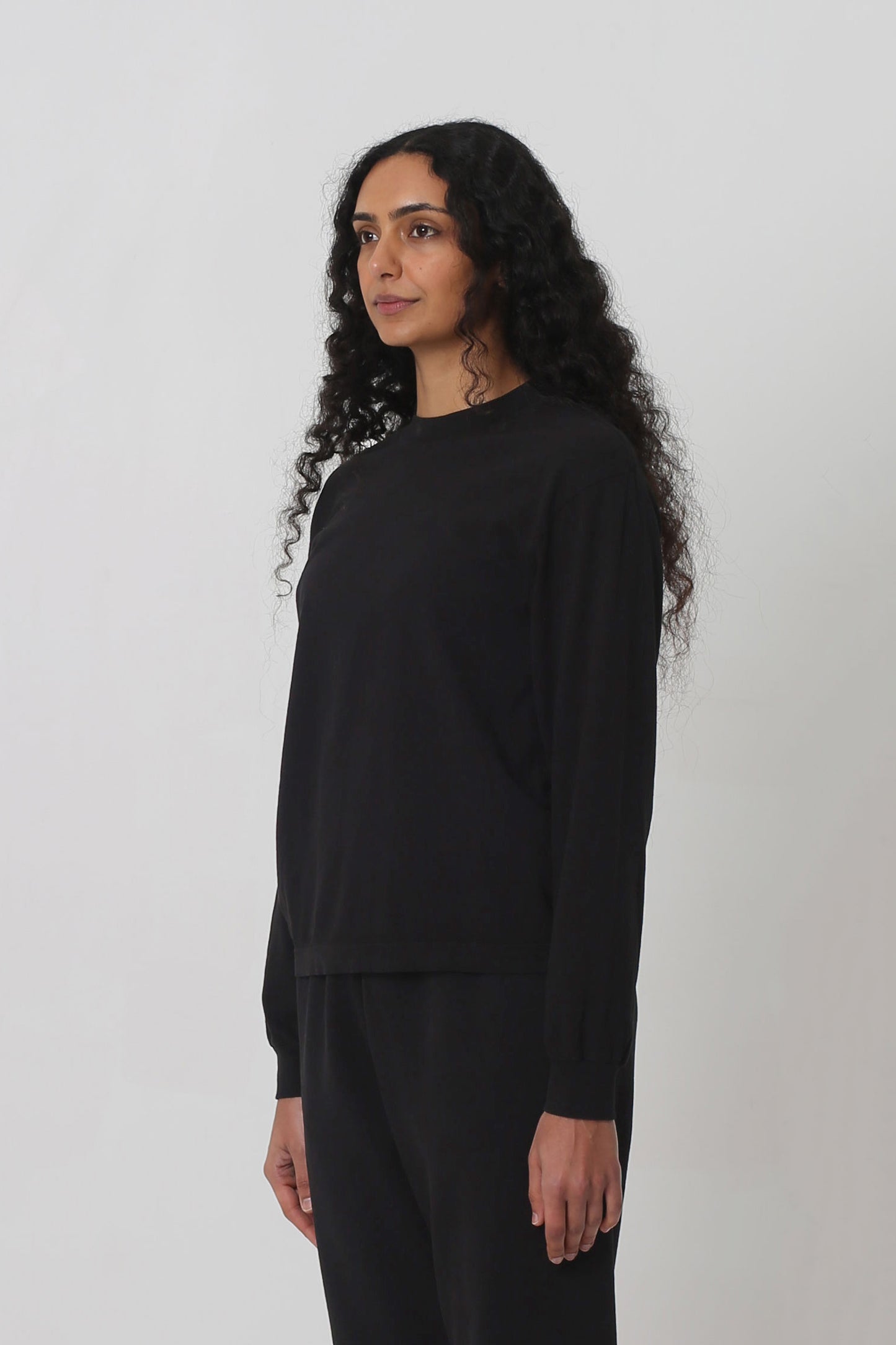 3/4 front view shows relaxed sleeves and rib cuff.
