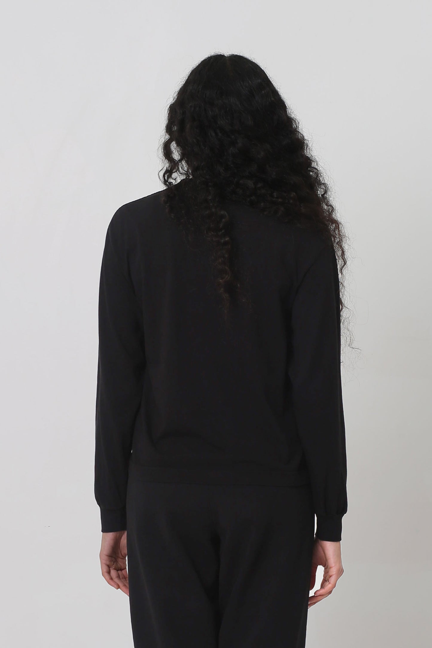 Back: shirt fabric is relaxed and hangs with a medium amount of ease. 