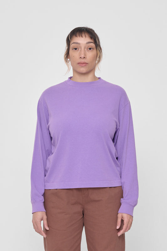 5'4" woman in a size S Carpe Diem Long Sleeve Boxier Trash Tee. Hem ends at her middle hip.