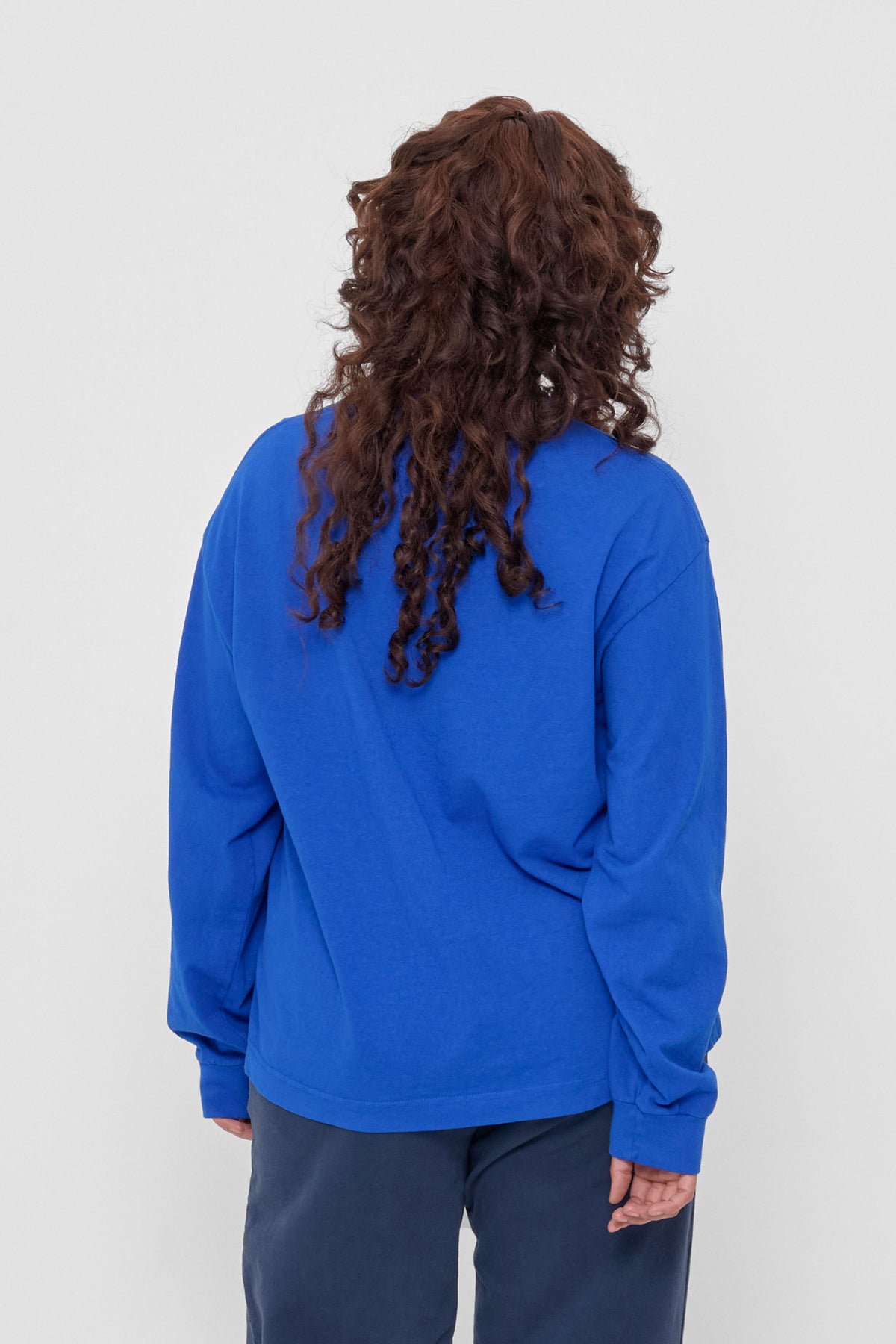 Long Sleeve Boxier Trash Tee in Garnet – back view on model