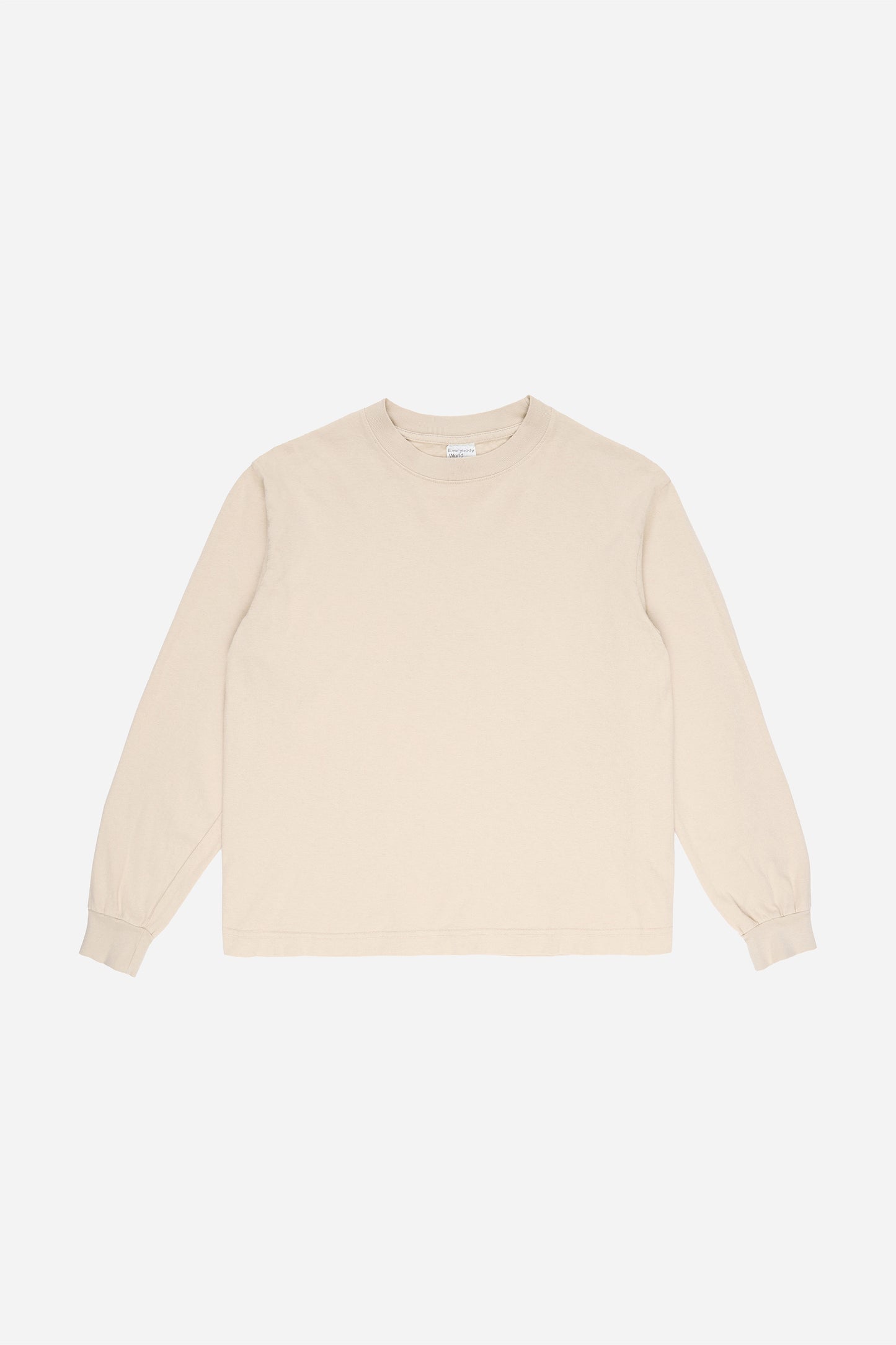 Flat lay of Oat Long Sleeve Boxier Trash Tee showing the cropped boxy silhouette.