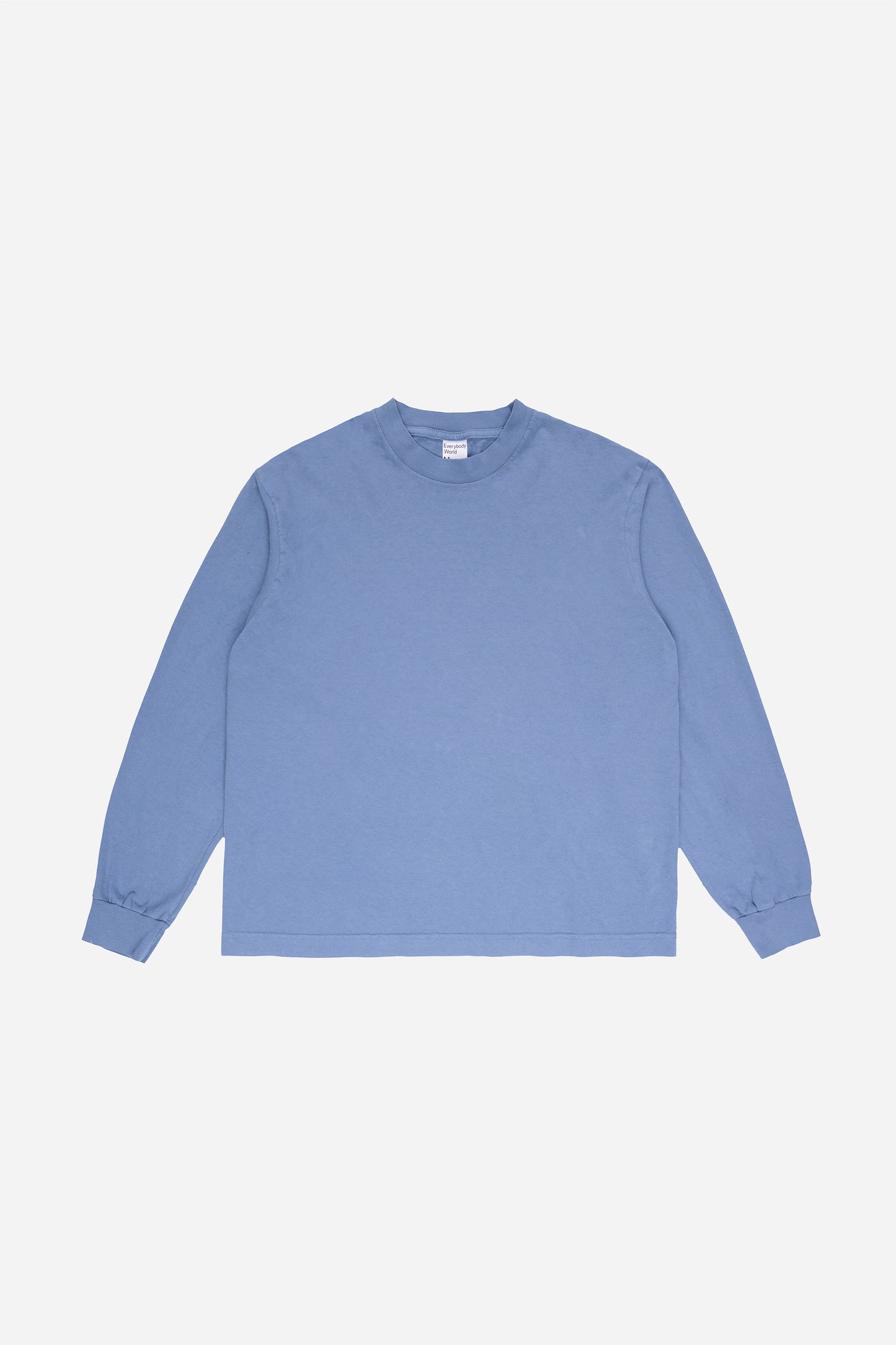 Flat lay of Periwinkle Long Sleeve Boxier Trash Tee showing the cropped boxy silhouette.
