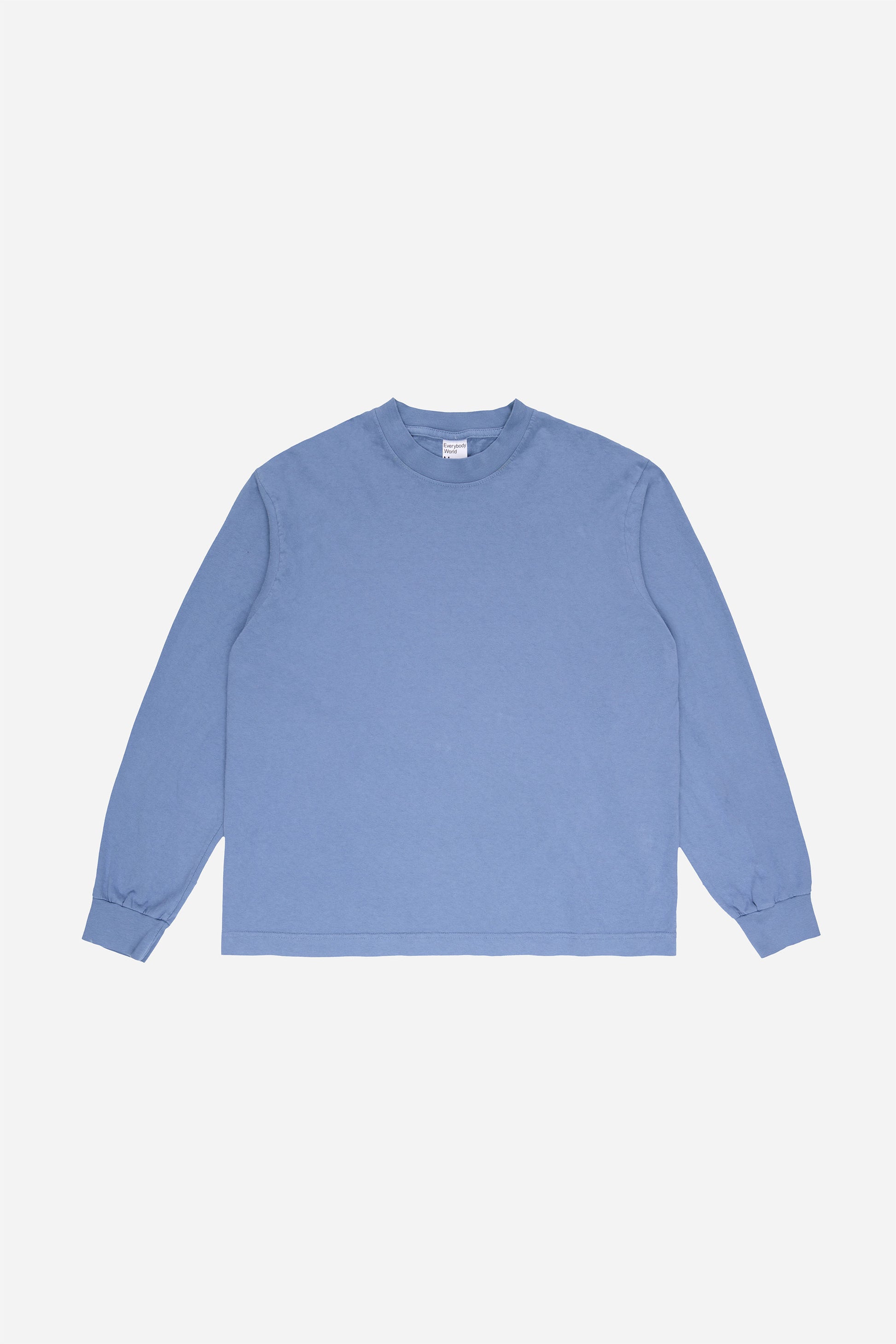 Flat lay of Periwinkle Long Sleeve Boxier Trash Tee showing the cropped boxy silhouette.