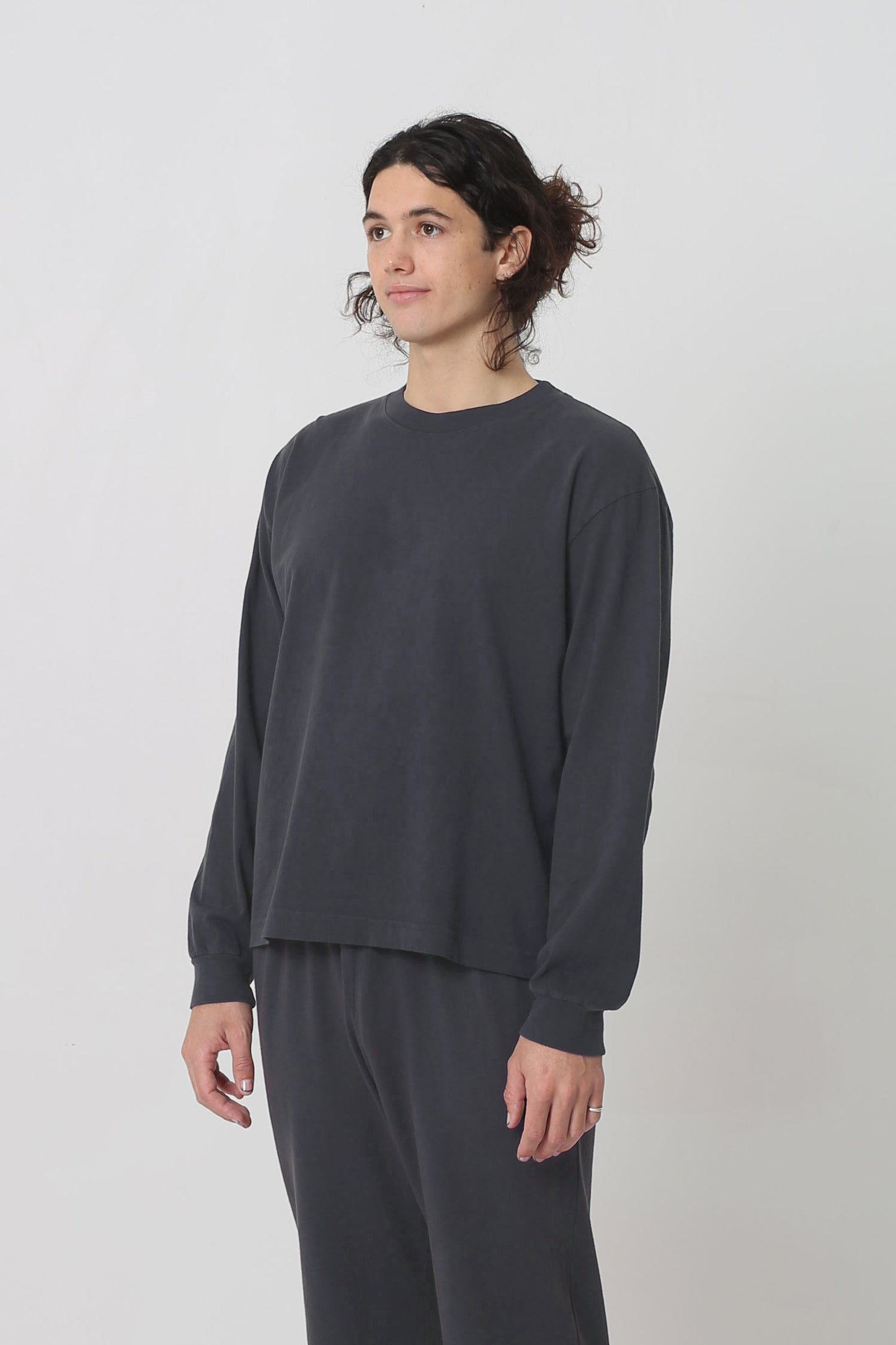 3/4 front view shows relaxed sleeves and rib cuff.