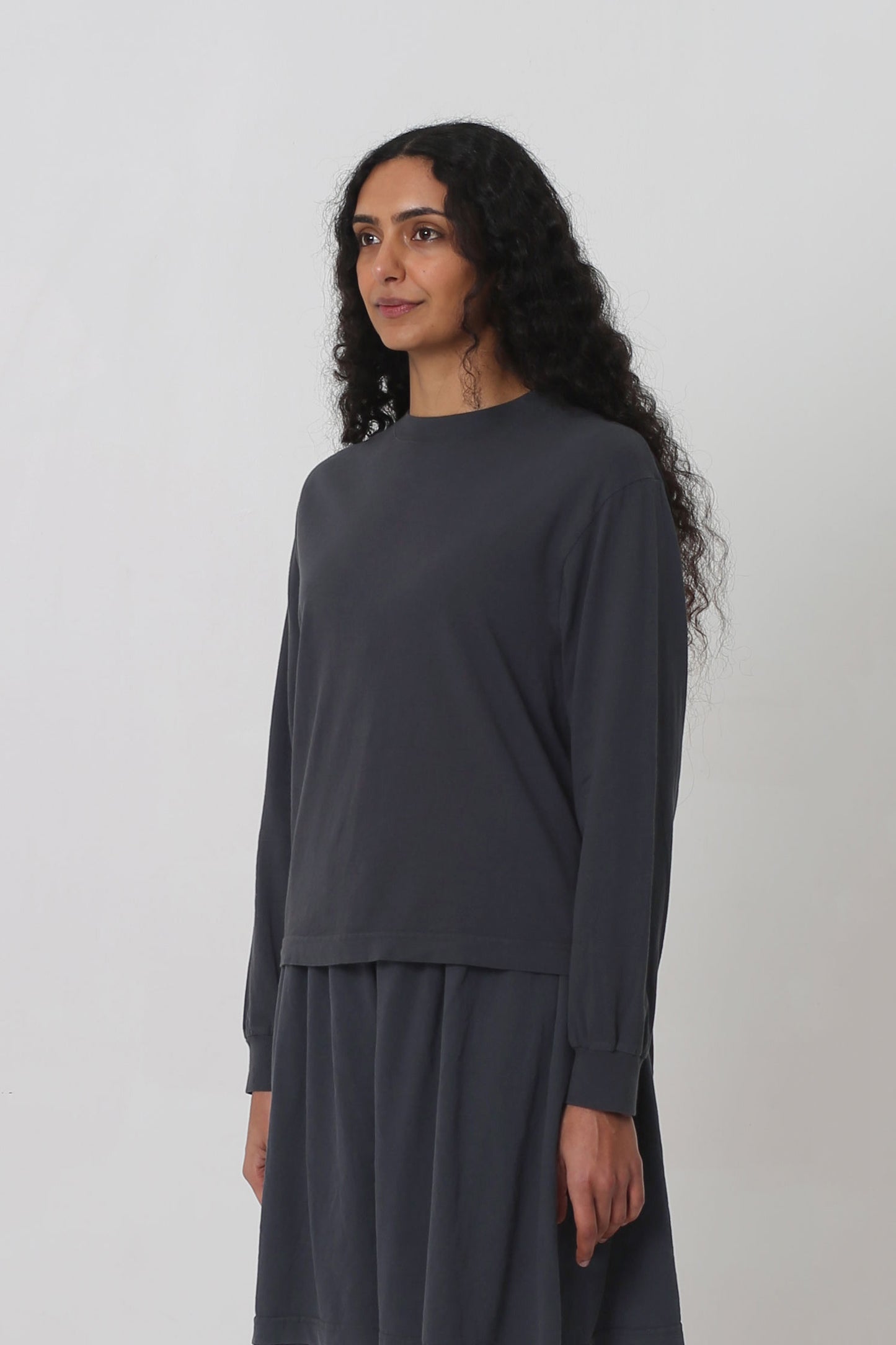 3/4 front view shows relaxed sleeves and rib cuff.