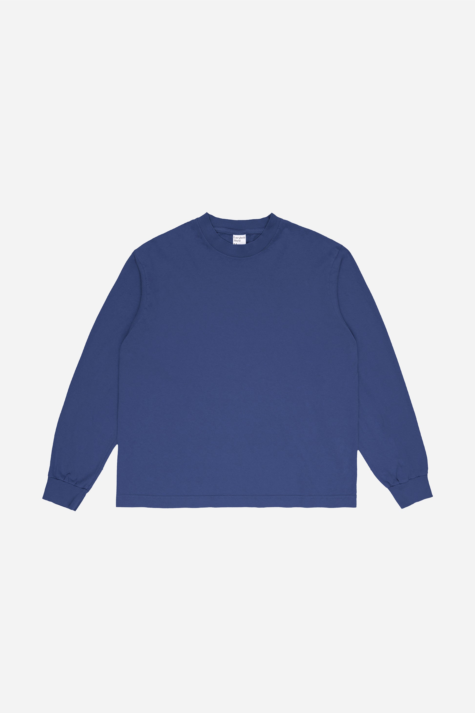 Flat lay of Washed Navy Long Sleeve Boxier Trash Tee showing the cropped boxy silhouette.