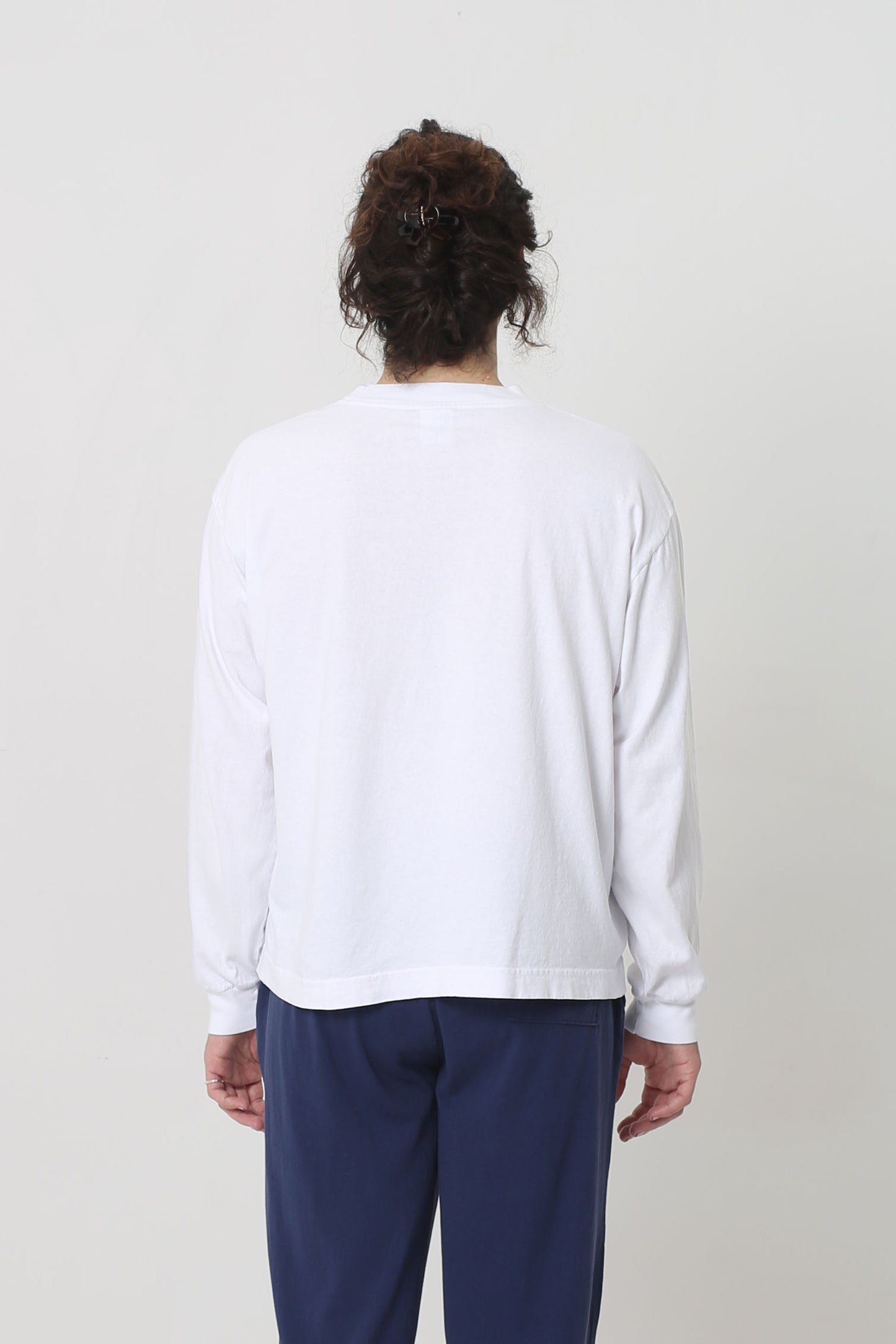 Back: shirt fabric is relaxed and hangs with a medium amount of ease. 