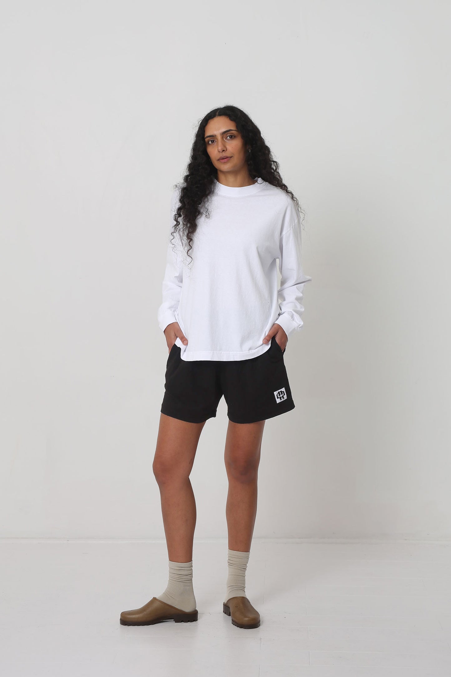 Styled with Black Everyday Shorts, Oat Squishy Socks and Plasticana Opana Mules.