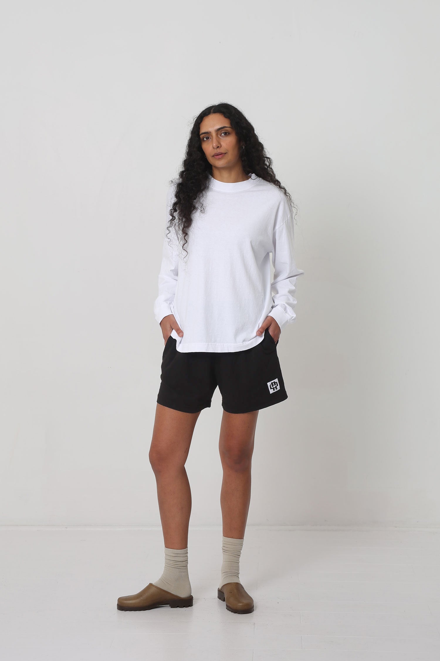 Styled with Black Everyday Shorts, Oat Squishy Socks and Plasticana Opana Mules.