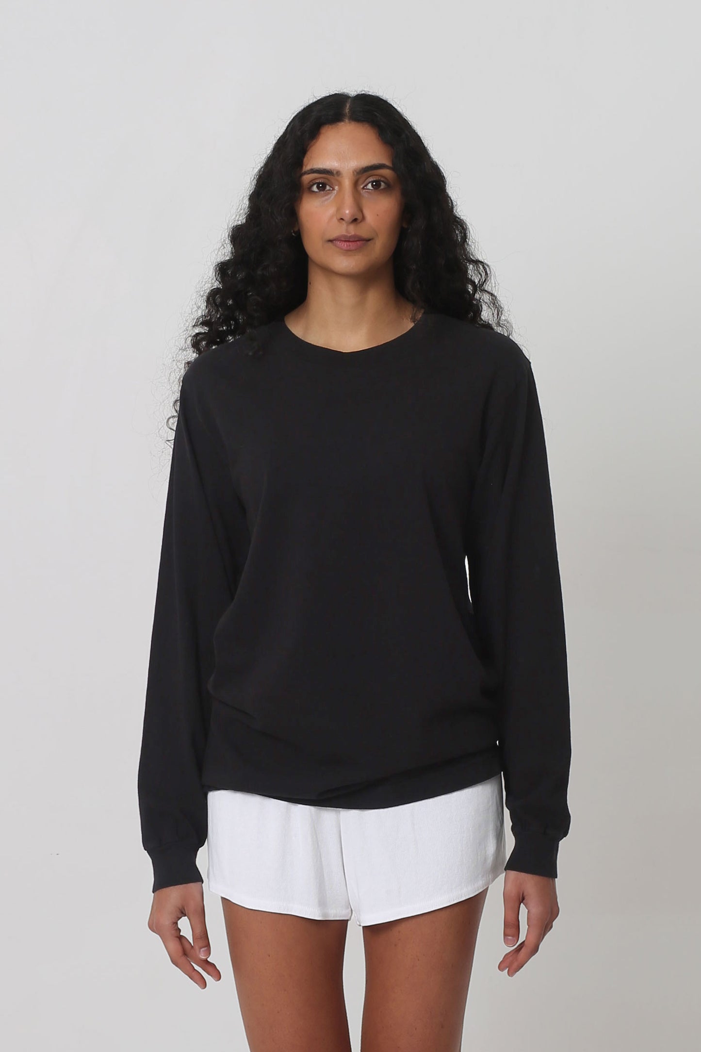 5'10" woman in size S Black Long Sleeve Trash Tee; shirt hem just below the hip.