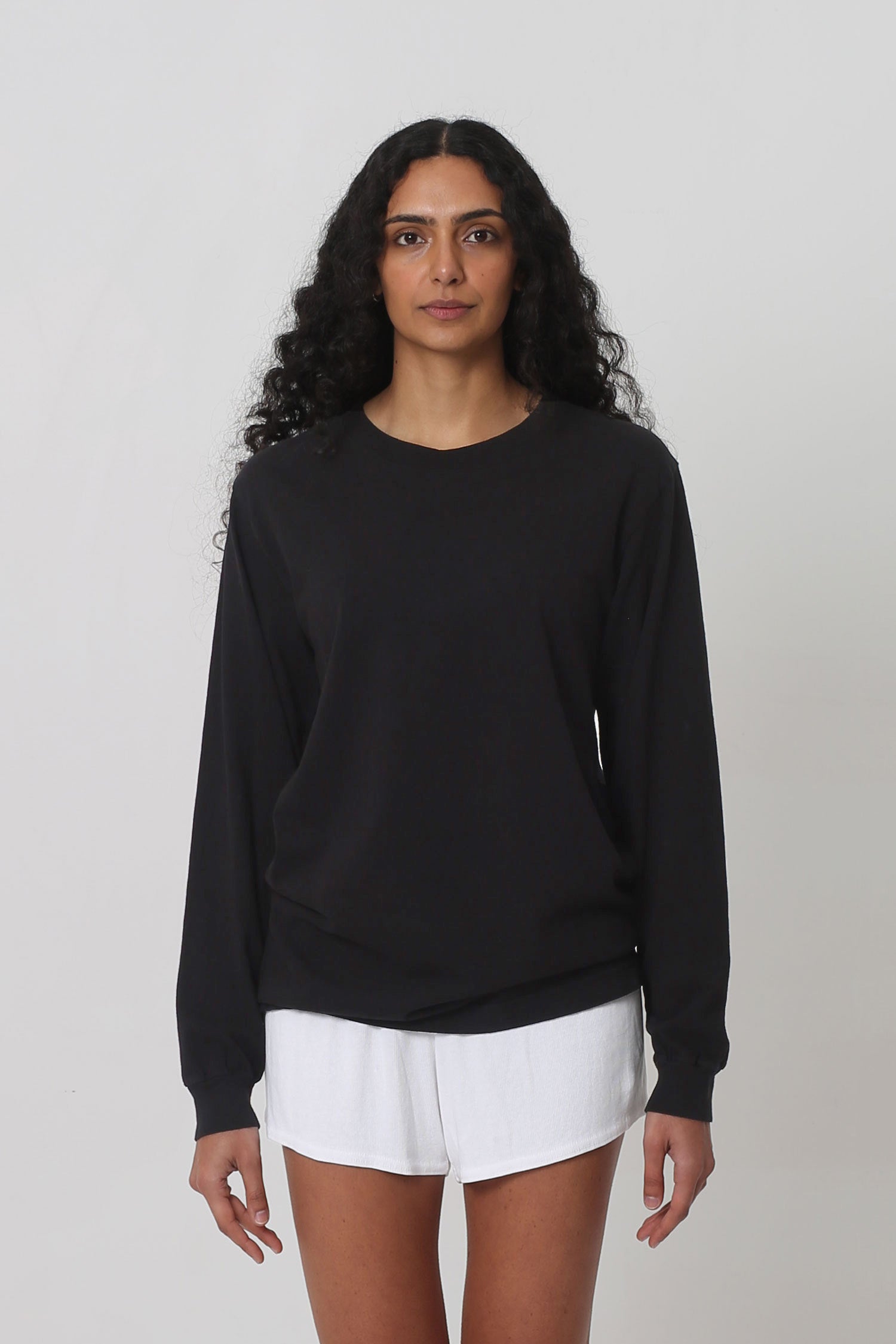5'10" woman in size S Black Long Sleeve Trash Tee; shirt hem just below the hip.