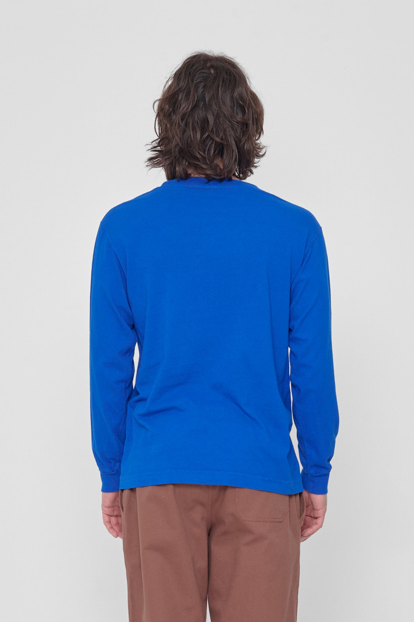 Back view showing fabric drape and relaxed fit throughout.