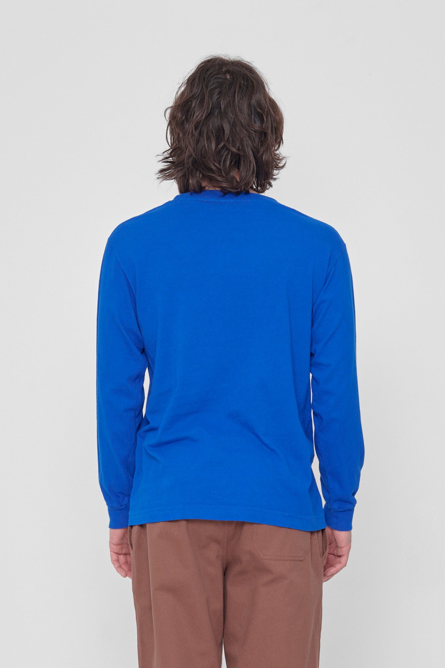 Back view showing fabric drape and relaxed fit throughout.