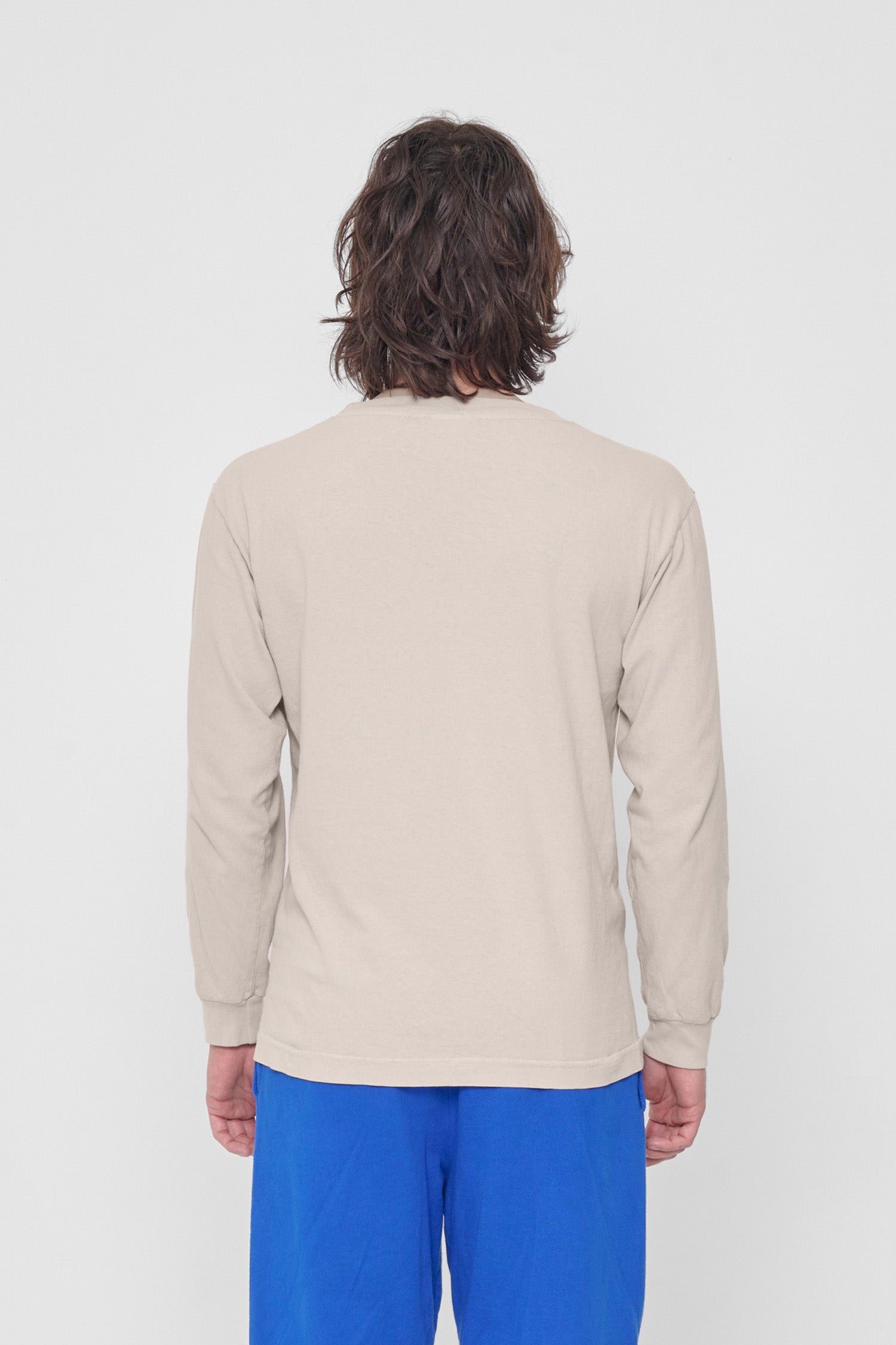 Back view showing fabric drape and relaxed fit throughout.