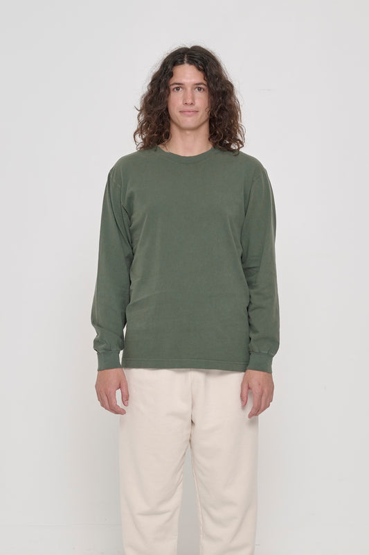6' person wearing a Pine Long Sleeve Trash Tee in size M. Shirt hem hits the lower hip. 